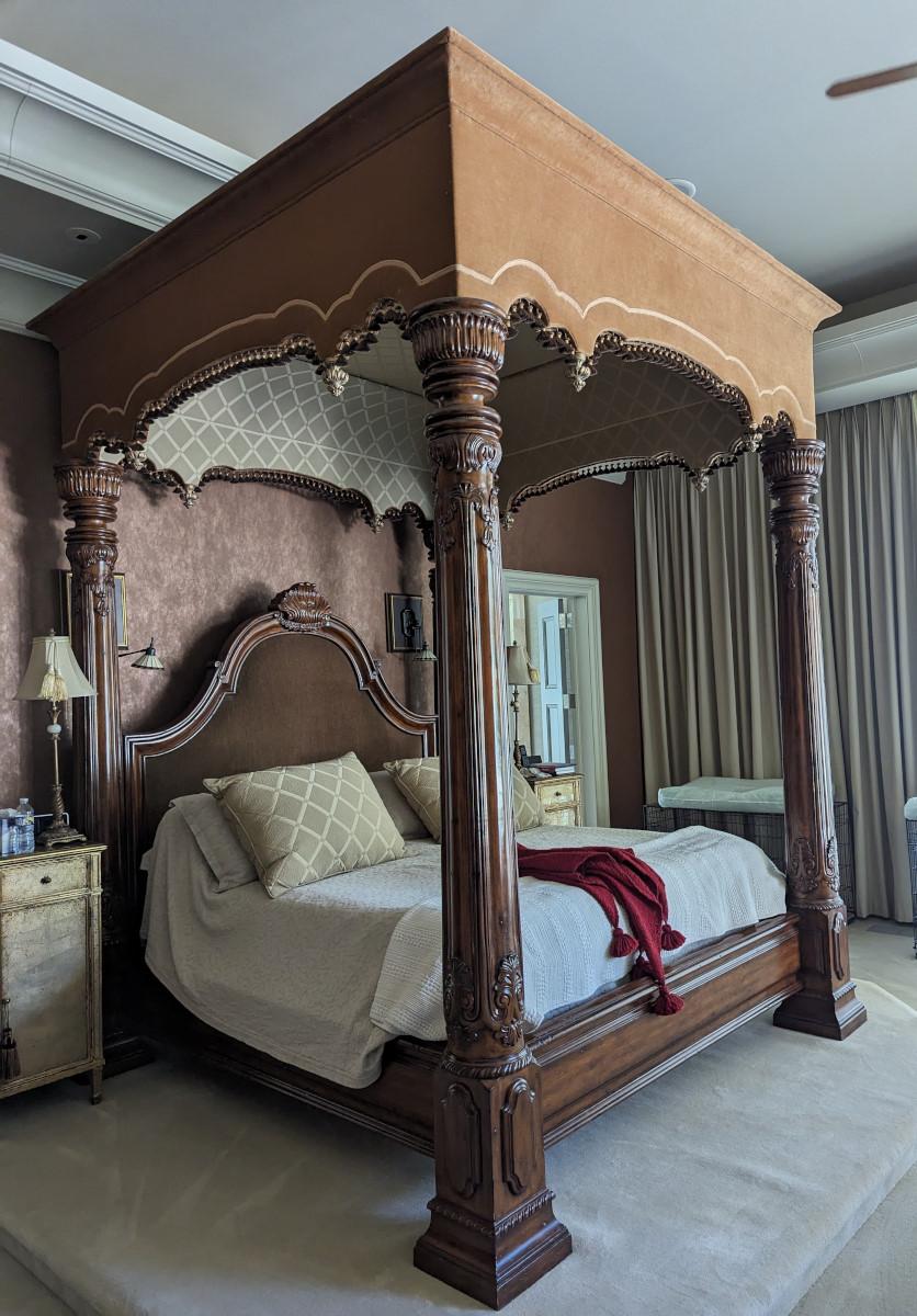 What a stunner! Treat yourself like royalty! King size bed, Wood frame, Tall upholstered headboard (brownish color velvet like fabric), Low profile footboard, The canopy upholstery is velvet and what appears to be a Damask fabric, Canopy color is a