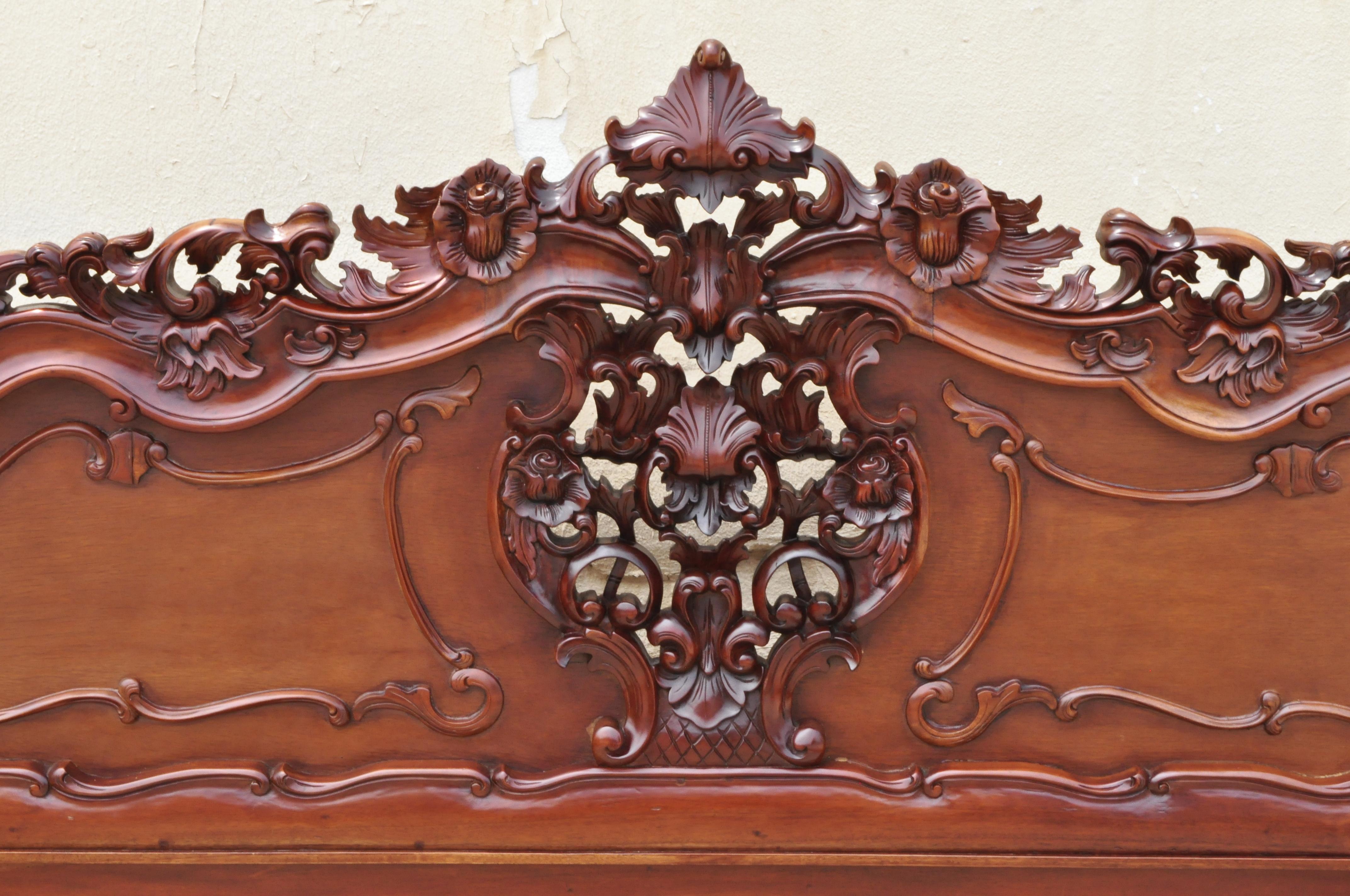 King size carved wood French rococo style ornate fancy bed frame. Item features king size frame headboard, footboard, 2 rails, solid wood construction, beautiful wood grain, nicely carved details, circa late 20th century. Measurements: Headboard: