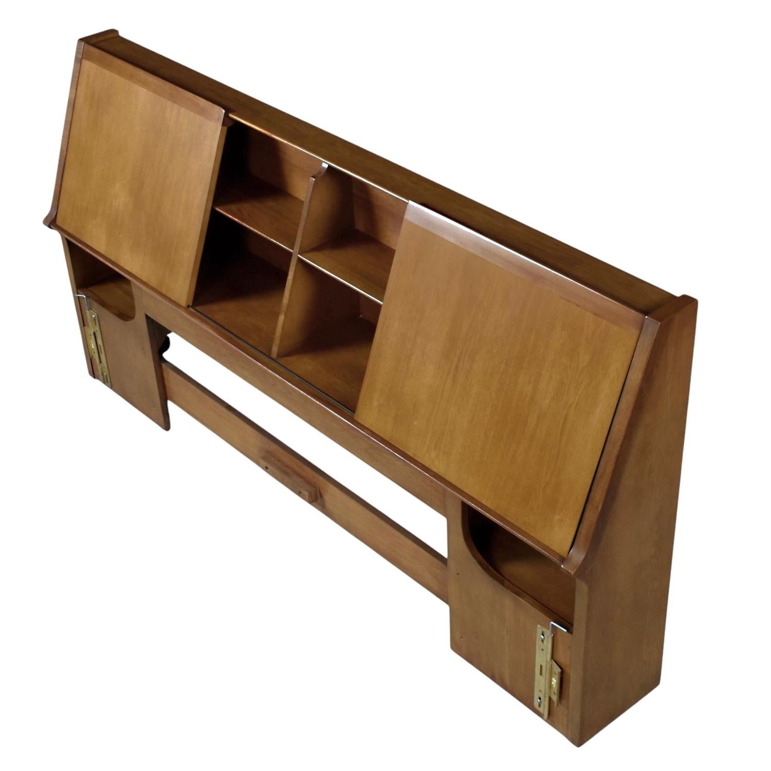 K19 “Utility” headboard John Van Koert for Drexel’s “Profile” collection. The luxurious American walnut wood headboard has solid wood sliding doors. The doors slide the length of the headboard. Choose which areas you want to reveal and conceal. The