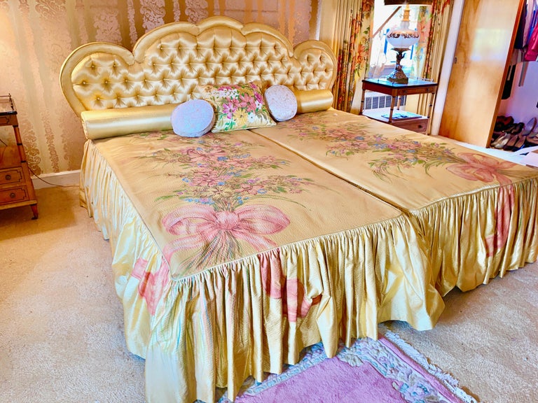 Remarkably clean and well preserved Hollywood Regency king sized yellow dressed bed custom made by Allen Furniture of Roslindale, MA circa 1962. Ensemble includes yellow silk tufted king sized headboard which is 52 inches high and 87 inches at its