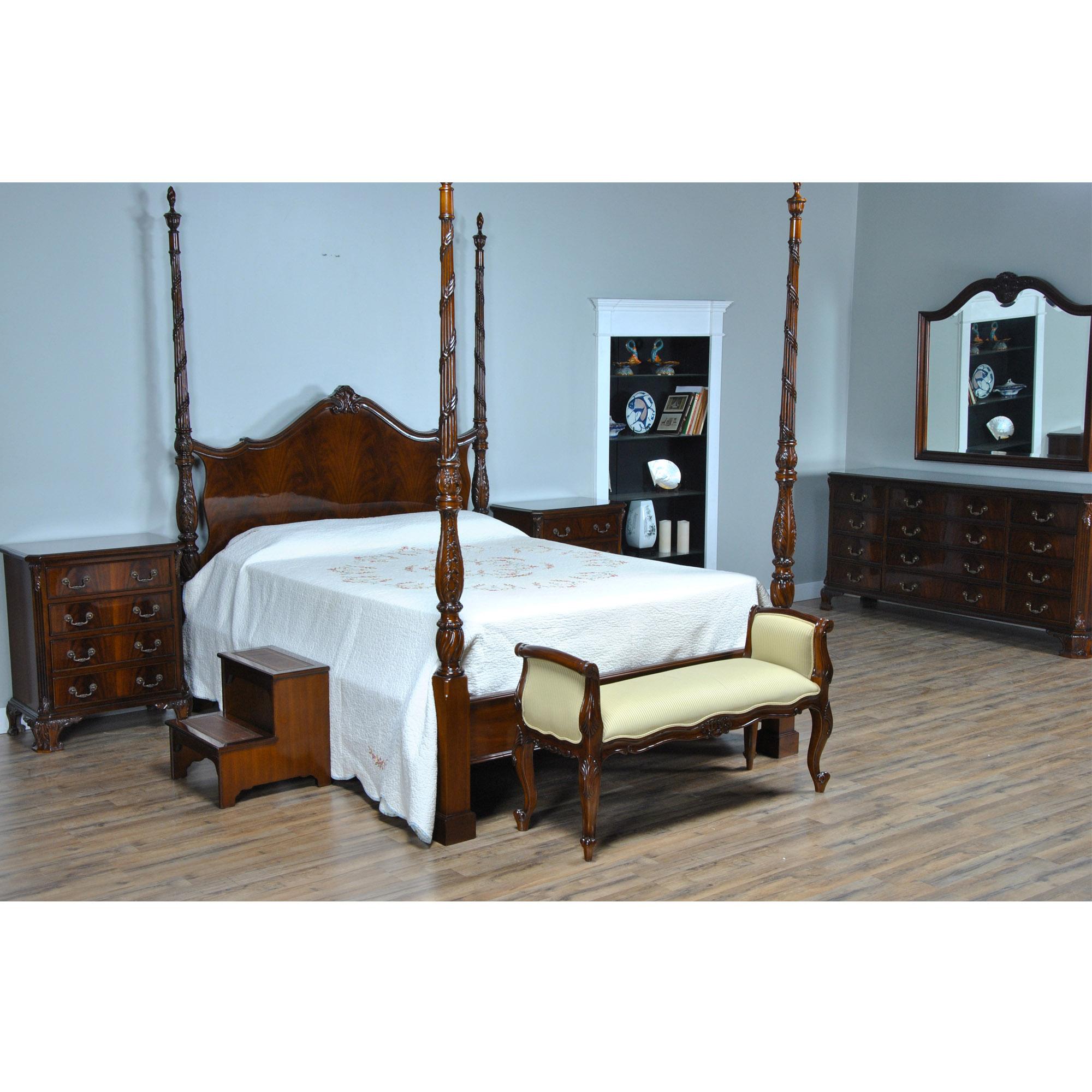 A beautiful King Size Mahogany Four Poster Bed. A high quality King Size Bed with Hand Carved Flame Finial Posts. Each post unfastens with metal fasteners for ease of transport and set up in the home. A Solid Mahogany Frame and the finest mahogany