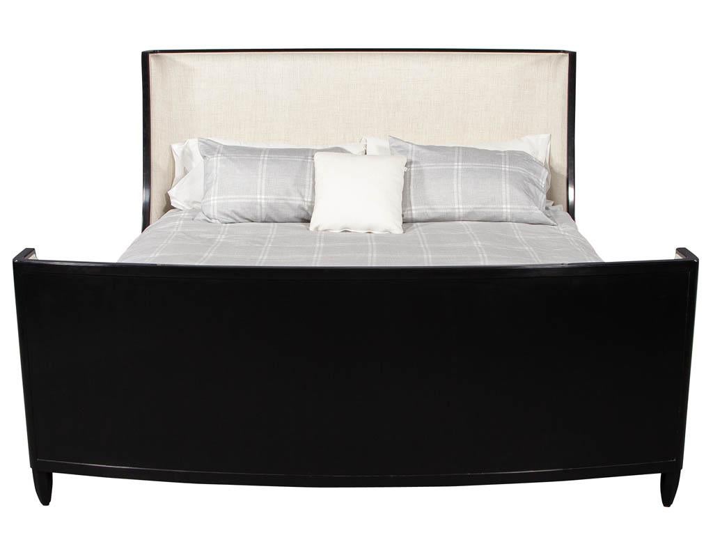 King size modern sleigh bed by Baker Furniture Barbara Barry. Finished in a polished black with textured linen headboard and footboard.
Pillows, comforter and mattress not included.
Measures: Headboard W 81”, H 52.25”, D 7.5”
Footboard W 81”, H