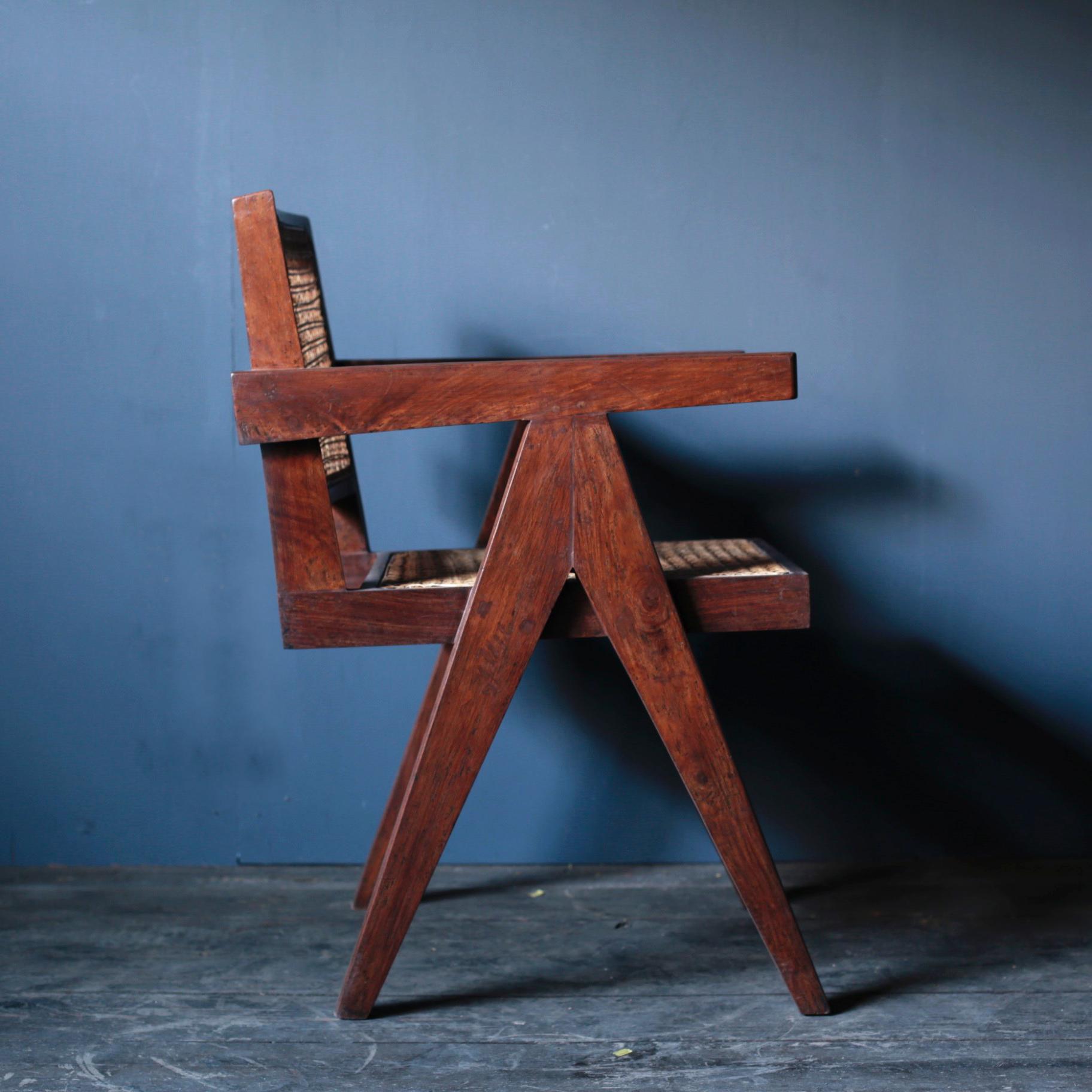 Pierre Jeanneret office chair, circa 1953-1954.
Teak and rattan. Intended for various administrative buildings, Chandigarh, India.
The body is original, the rattan has been replaced.

 