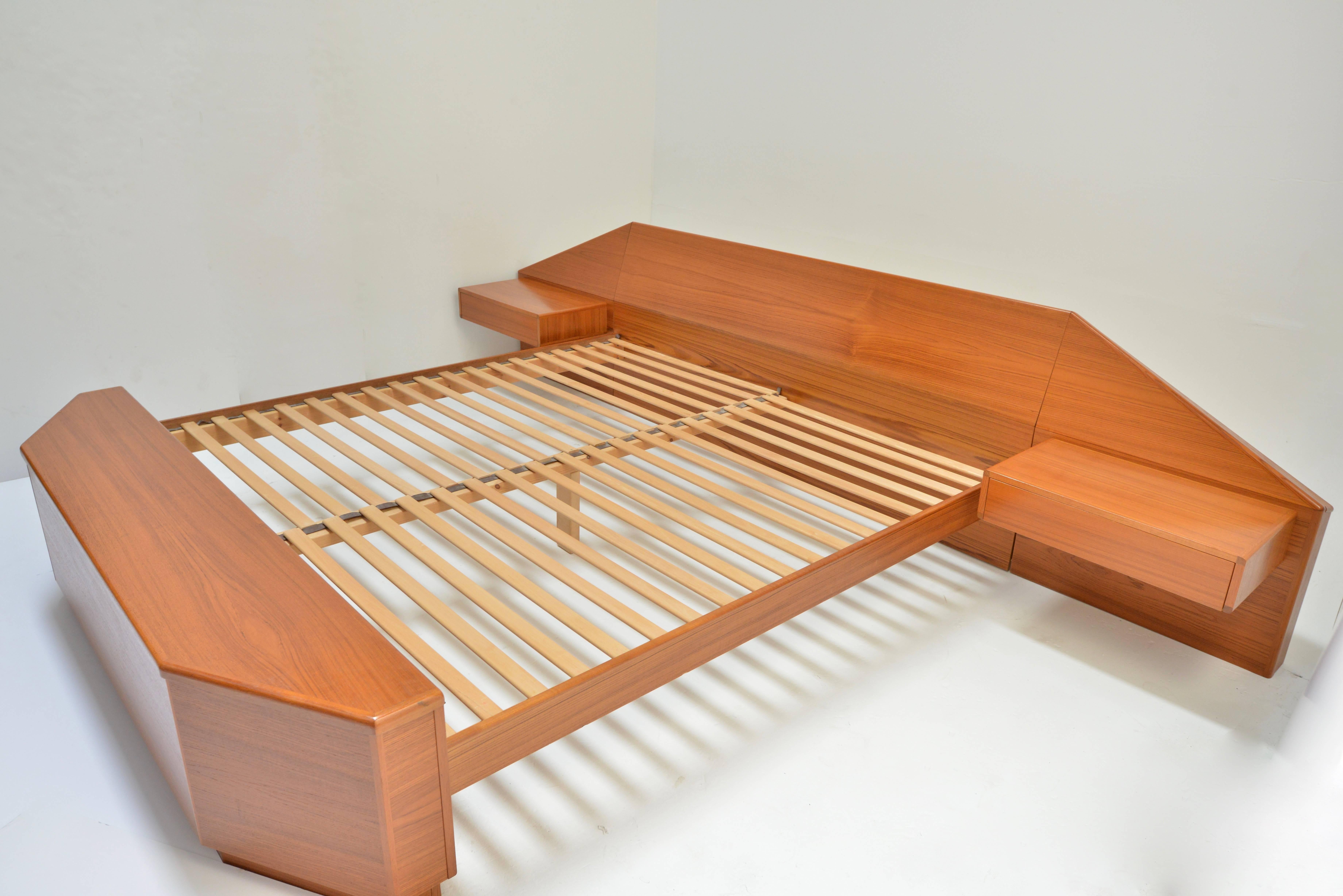 King-size teak platform bead with floating nightstands and footboard chest by Danish modernist Laurits M Larsen. In excellent condition. Fits standard king mattress.

 