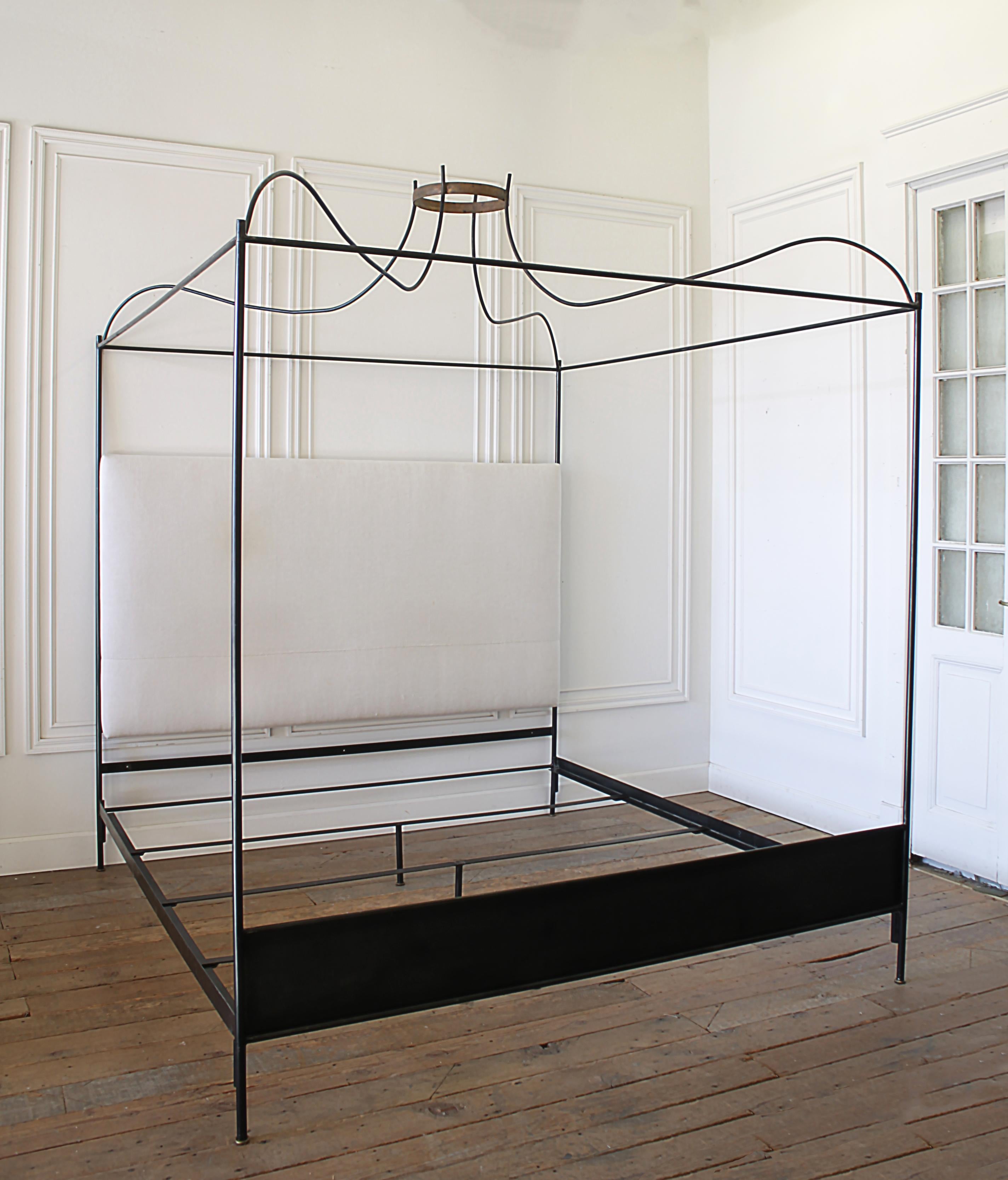 King size iron canopy bed with upholstered antique linen headboard
Custom iron canopy bed with gilt crown, and headboard (can be reupholstered in any material) This designer piece assemble easily and requires no additional hardware. Very solid and