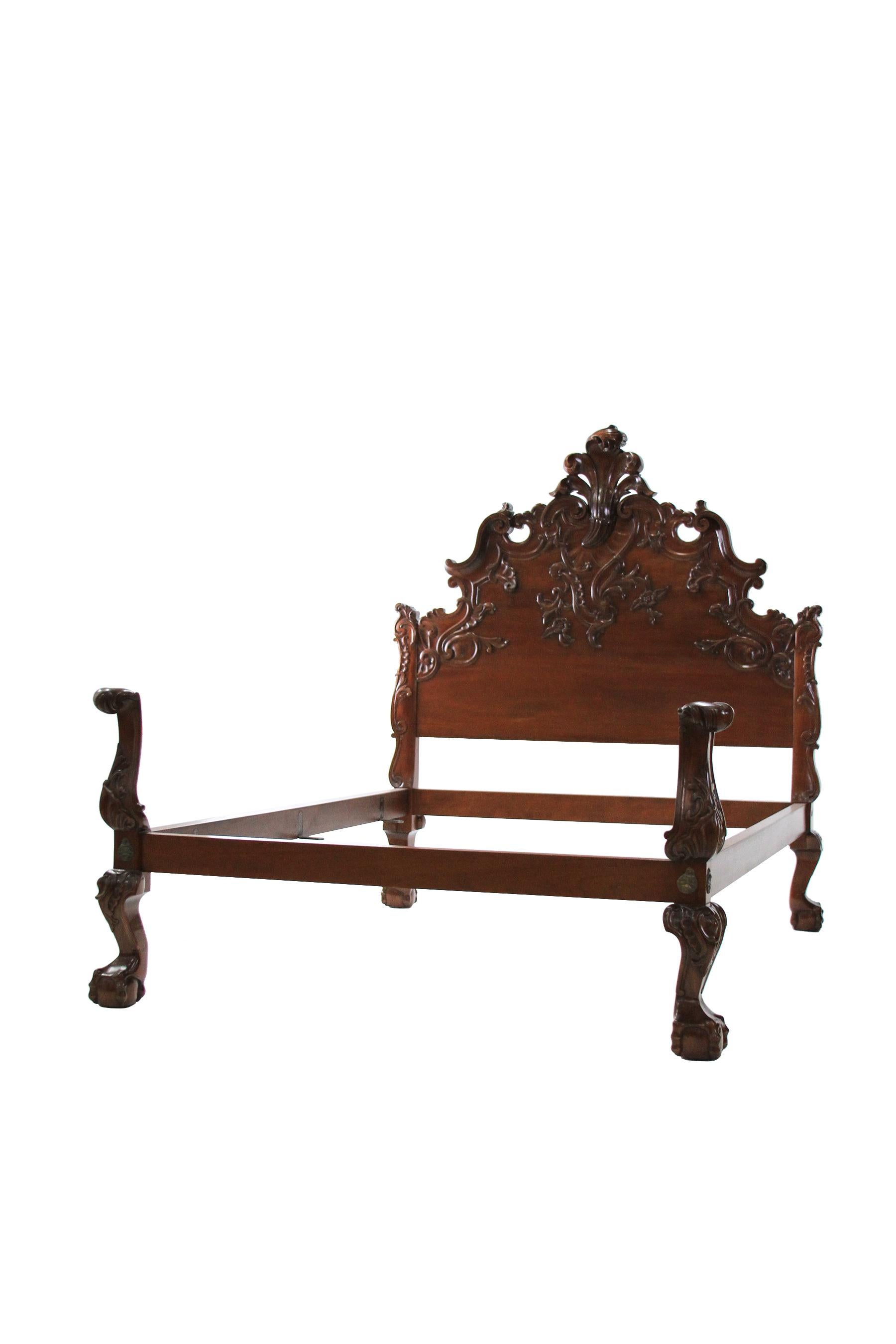 This limited edition King Sized Spanish Rococo style bed is hand-carved with a unique asymmetrically flourished headboard, intricately carved in solid Mahogany. This bed is shown in a Queen, there is only one King available and two Queens as a