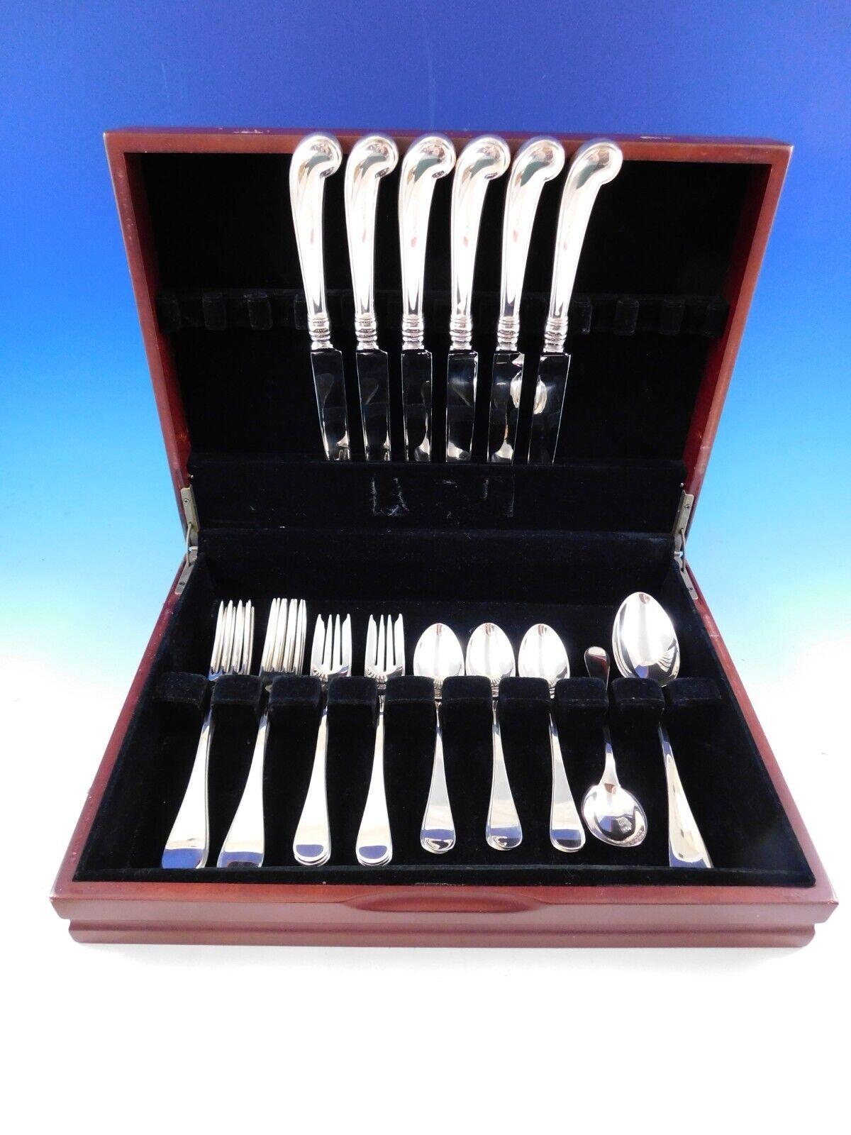 Dinner Size King William by Tiffany and Co. sterling silver Flatware set, 26 pieces. This Old English style pattern was introduced in the year 1870. The pieces are large and heavy, with wonderful pistol grip handle knives. This set includes:

6
