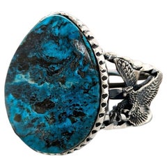 Kingman turquoise cabochon is encircled by hand-sculpted bezels, collage of blue