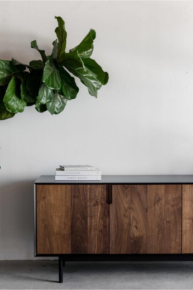 The Kings Credenza is handmade locally in Los Angeles, California. A simple combination of natural material and modern design, the long, lean body of the Kings Credenza fits nearly any aesthetic. The modern, matte black casing of the credenza’s
