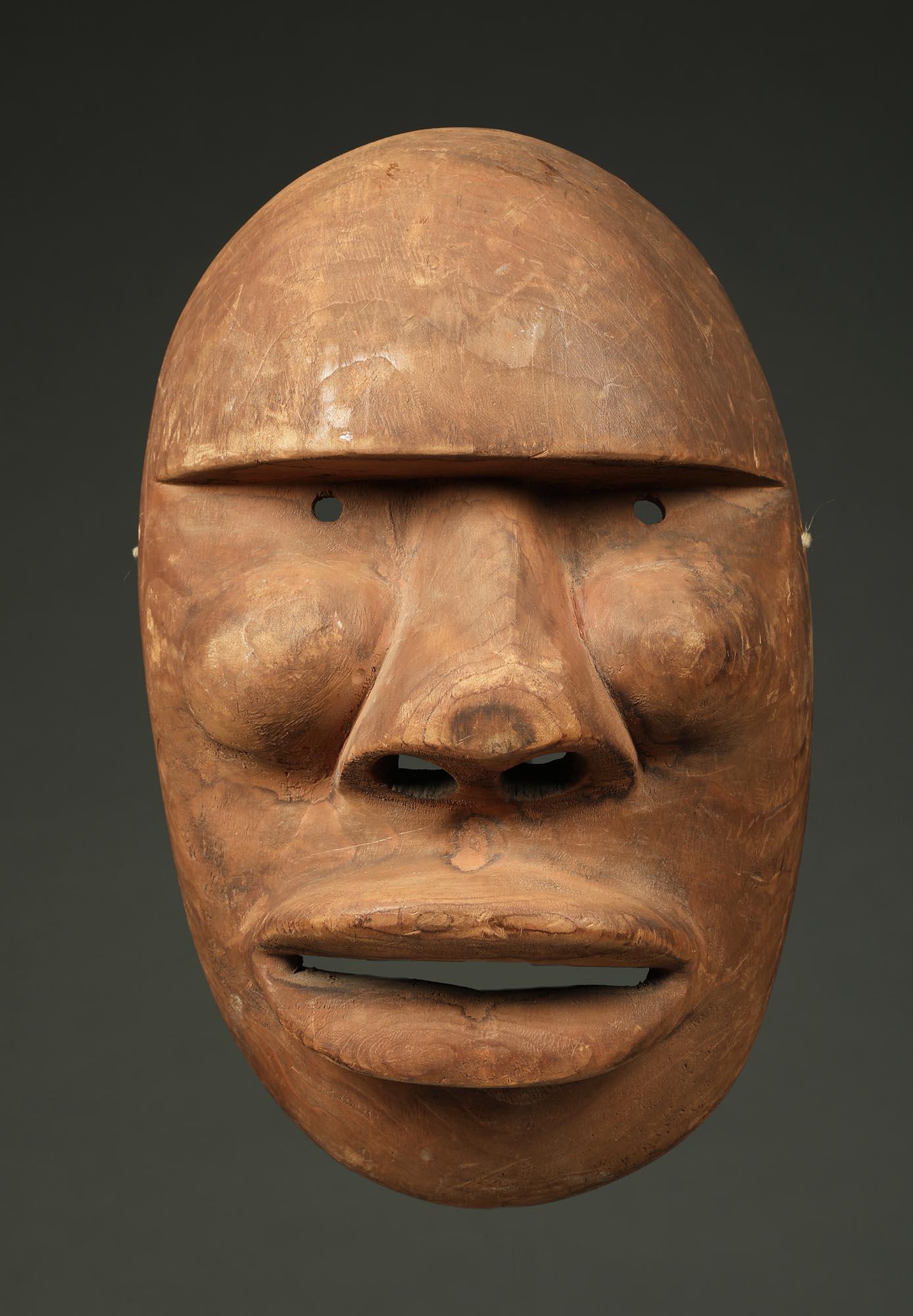 Early powerful cubist mask from King Island, Alaska 1st nation peoples. King Island, created late 19th to early 20th century 

Mask is 10 1/2 inches high.  old oxidized wood.


