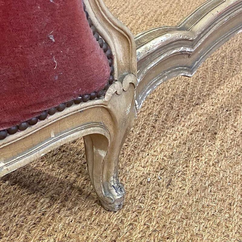 King size (5’ wide) Antique French upholstered bed which is awaiting restoration. This is a particularly old frame circa 1890 with pretty side rails and delicate carved flowers. The paint is wonderful and distressed. 

The price indicated includes a
