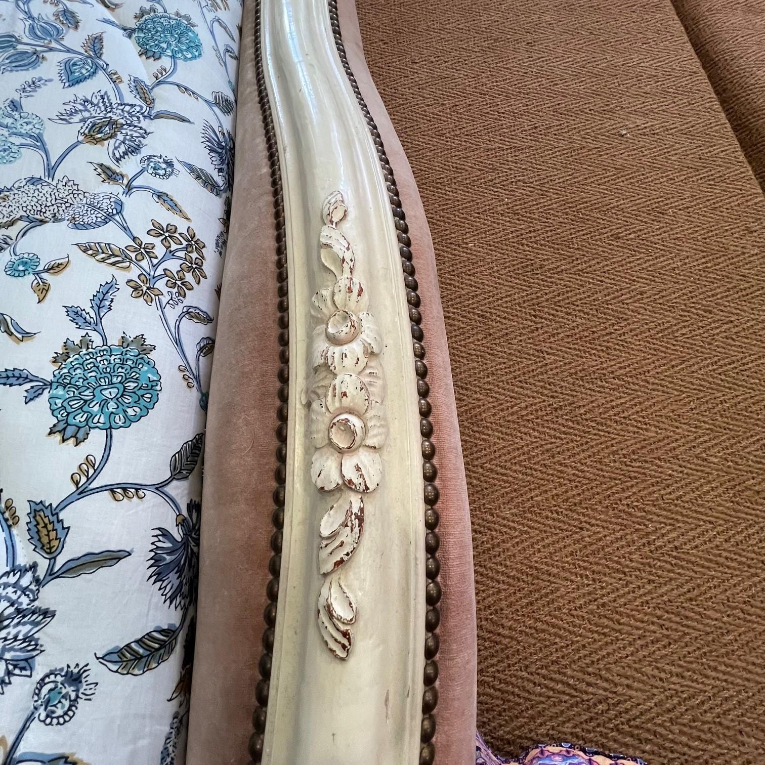 A very pretty French antique roll top upholstered bed which has the original paint. The frame is elegant and can be recovered in your choice of fabric. Included in the cost is a new upholstered bed base so the only extra would be the fabric and a