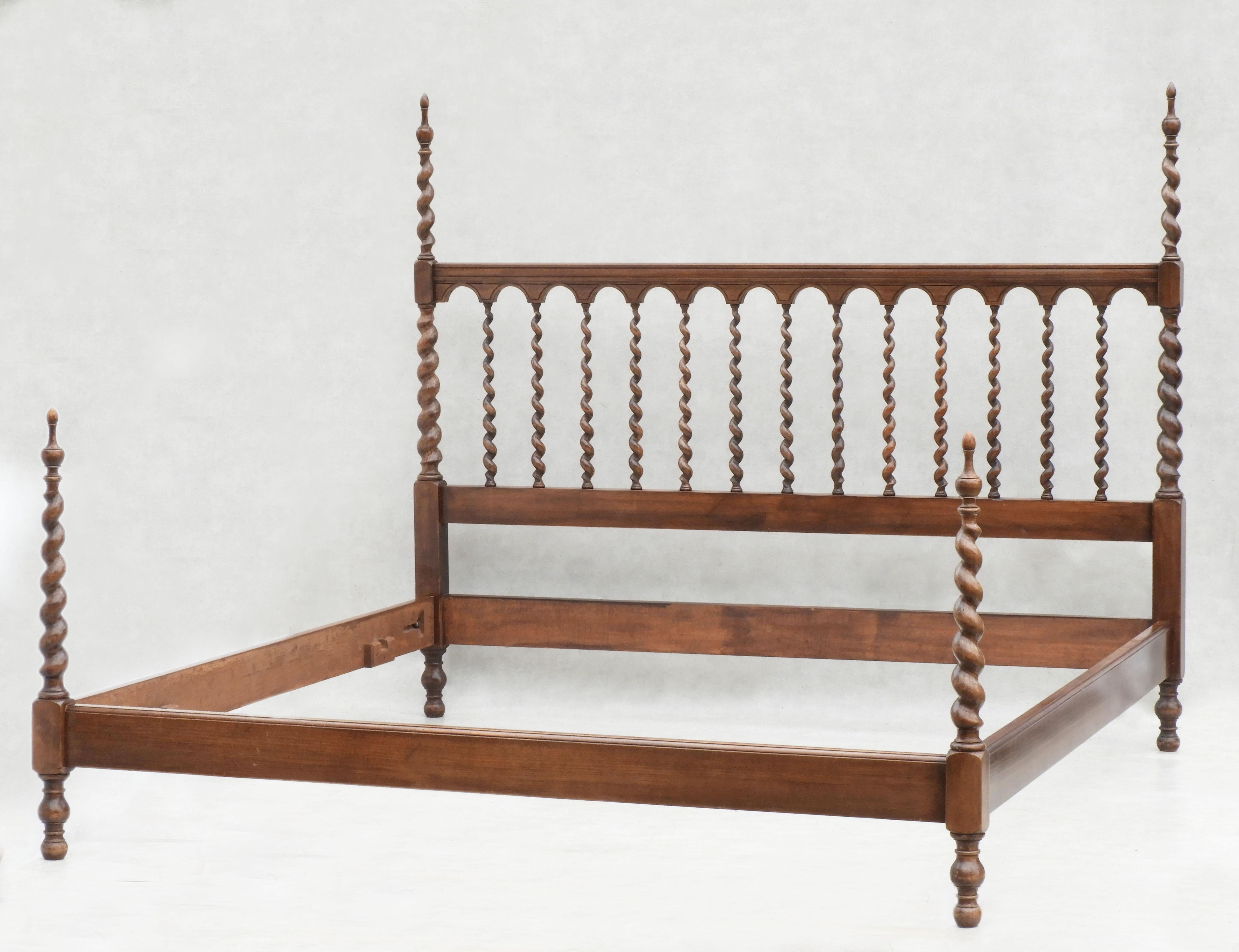 Beautiful barley twist four post bed C1960s Paris.

A specially commissioned Artisan crafted bed spindle wood bed with carved torsade posts at each corner with the spiral theme continuing through to the headboard. Originally made to fit two French