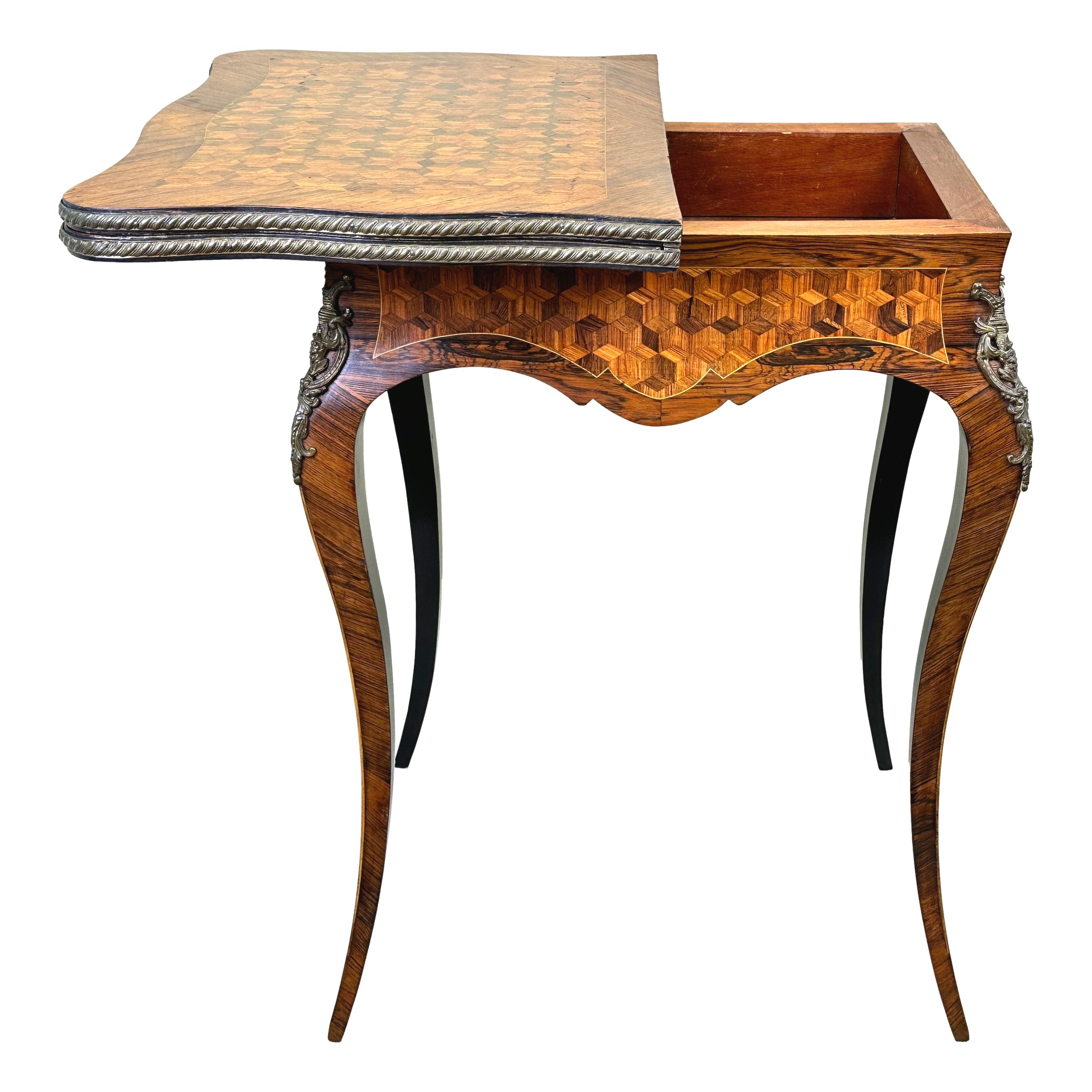 An Exceptional Quality Late 19th Century Kingwood And Tulipwood, Serpentine Shaped Card Table, With Exceptional Ormolu Mounted And Parquetry Inlaid Decoration Throughout, The Rotating, Foldover Top Having Baized Playing Surface And Storage Well,