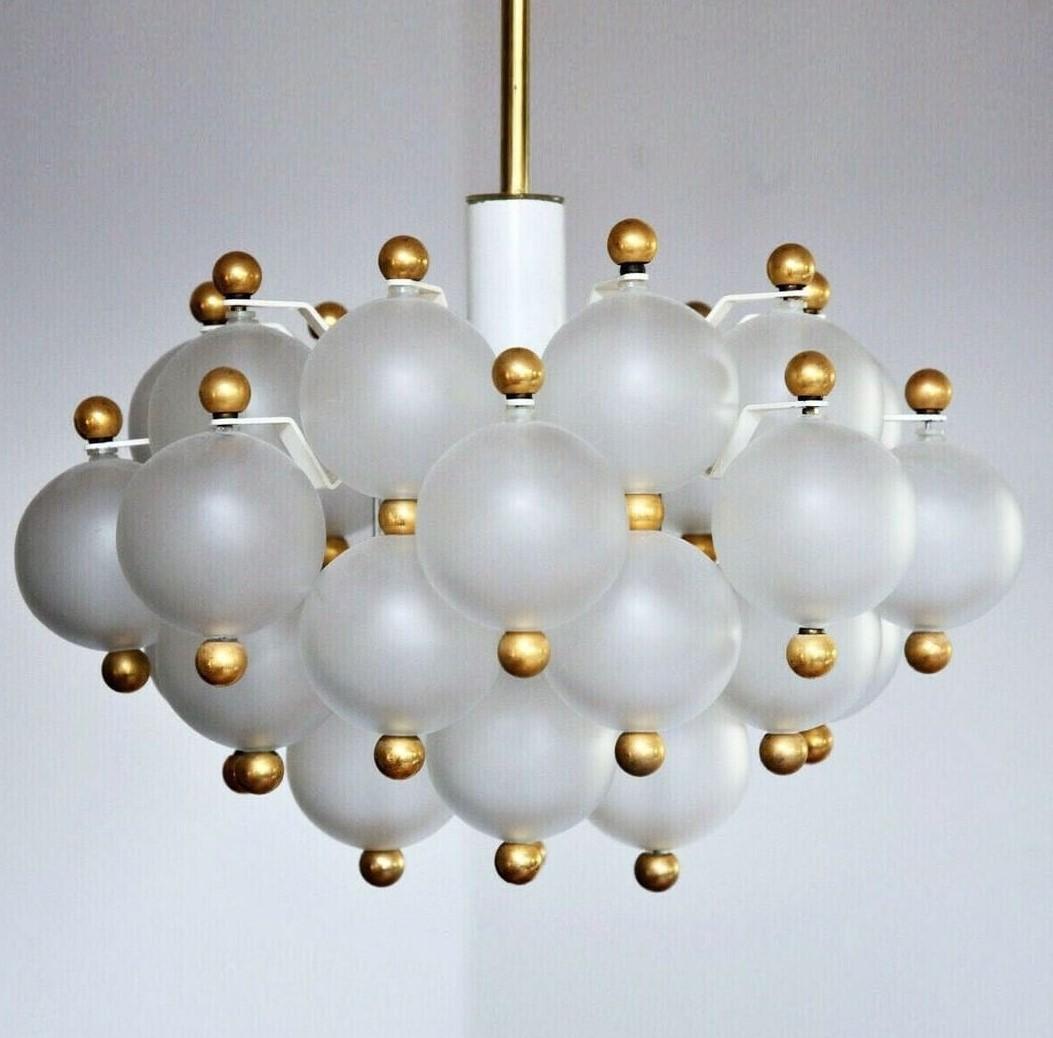 This is a gorgeous example of Kinkeldey famous Frosted Glass Spheres and Brass Ball finial Pendant Lights made in Germany in the 1950s and 60s. In a cloud like formation this is a very pretty ceiling light that will brighten up any home and
