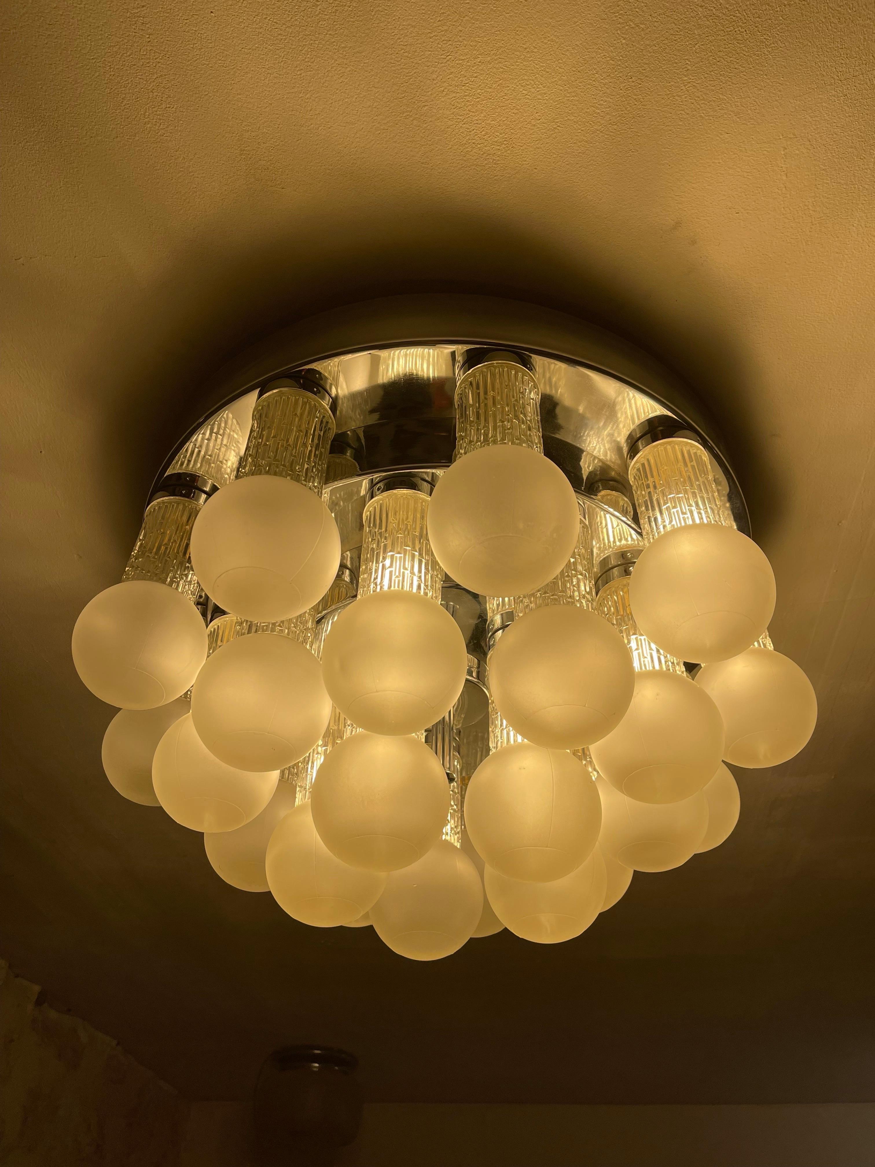 Exceptional Kinkeldey ceiling light with cut glass and globe with chrome structure. The Design and the quality of the glass make this piece the best of the Austrian Design.

Ceiling light with more than 25 tube-shaped tulips and ending with a tall