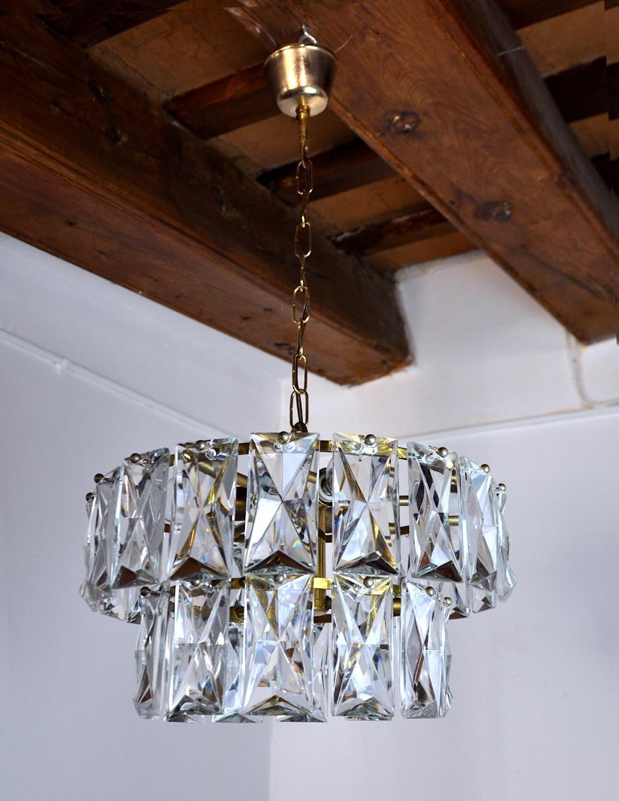 Superb kinkeldey chandelier designated and produced in Germany in the 70s. Golden brass structure composed of cut crystals spread over 2 floors. Rare design object that will illuminate your interior wonderfully. Electricity checked, marks of time