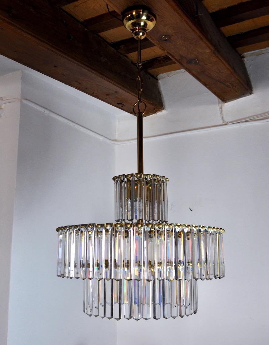Super and rare kinkeldey chandelier designated and produced in Germany in the 70s. Golden brass structure composed of cut crystals in perfect condition spread over 3 floors. Rare design object that will illuminate your interior wonderfully.