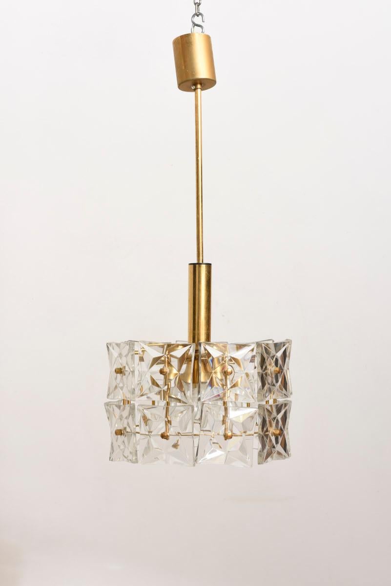 A Kinkeldey crystal faceted pendant lamp with Brass ,1970s frame.

Kinkeldey-Leuchten was located in Bad Pyrmont in between Hannover and Bielefeld in Germany. Bad Pyrmont is a city with some 19.000 inhabitants and is a popular spa resort.

