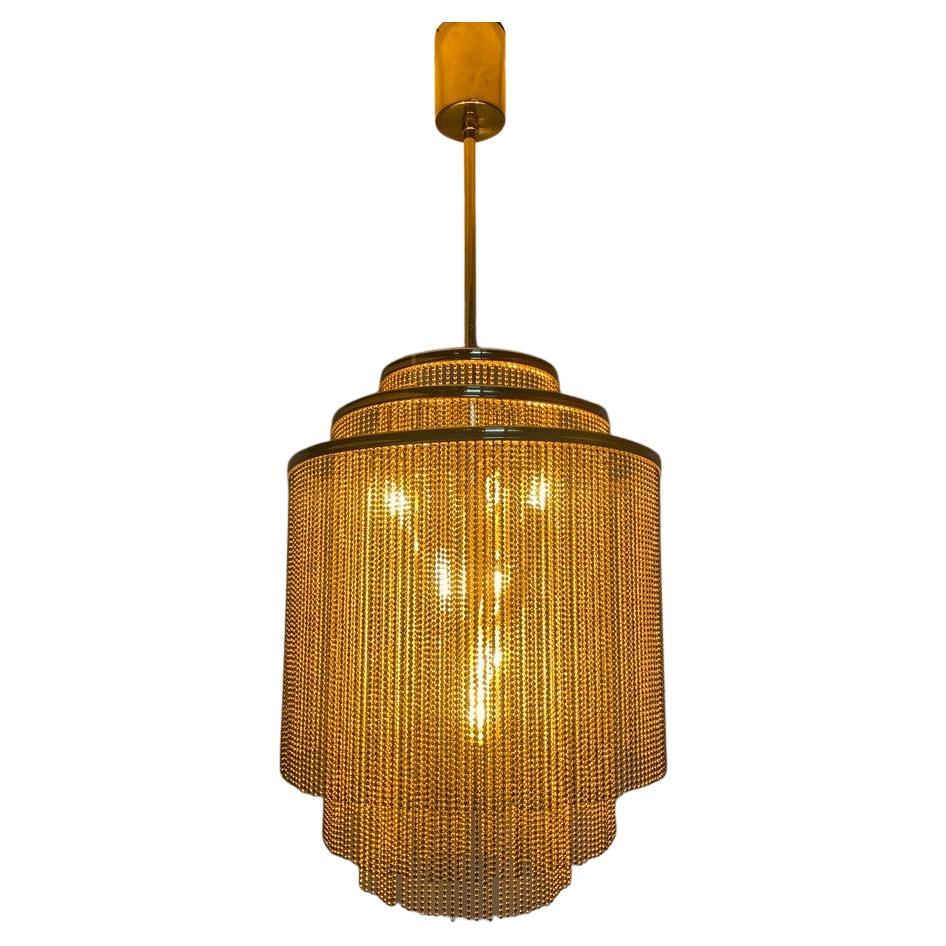 Very rare, stunning Kinkeldey brass chandelier. Whether floating above a moody dining room or anchoring a sophisticated lounge, its sensual glow and timeless geometry elevate the atmosphere with subtle drama. Also very good for the bedroom. 

More