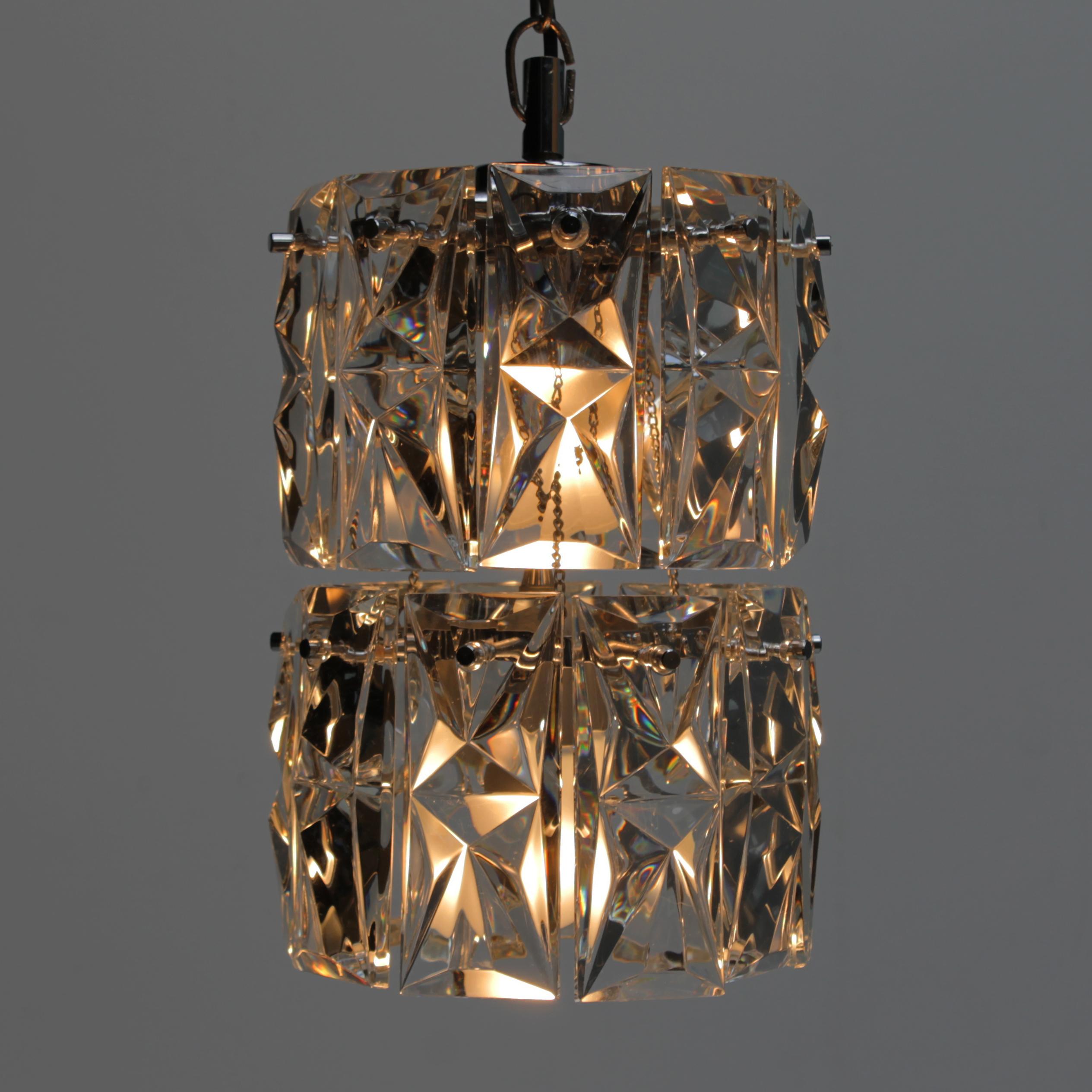 German Kinkeldey 2-tier pendant with 18 faceted crystals and two light sources.

Kinkeldey is German manufacturer of high end lighting fixtures. The company attracted international attention when they won the prestigious IF Design Award in 1969