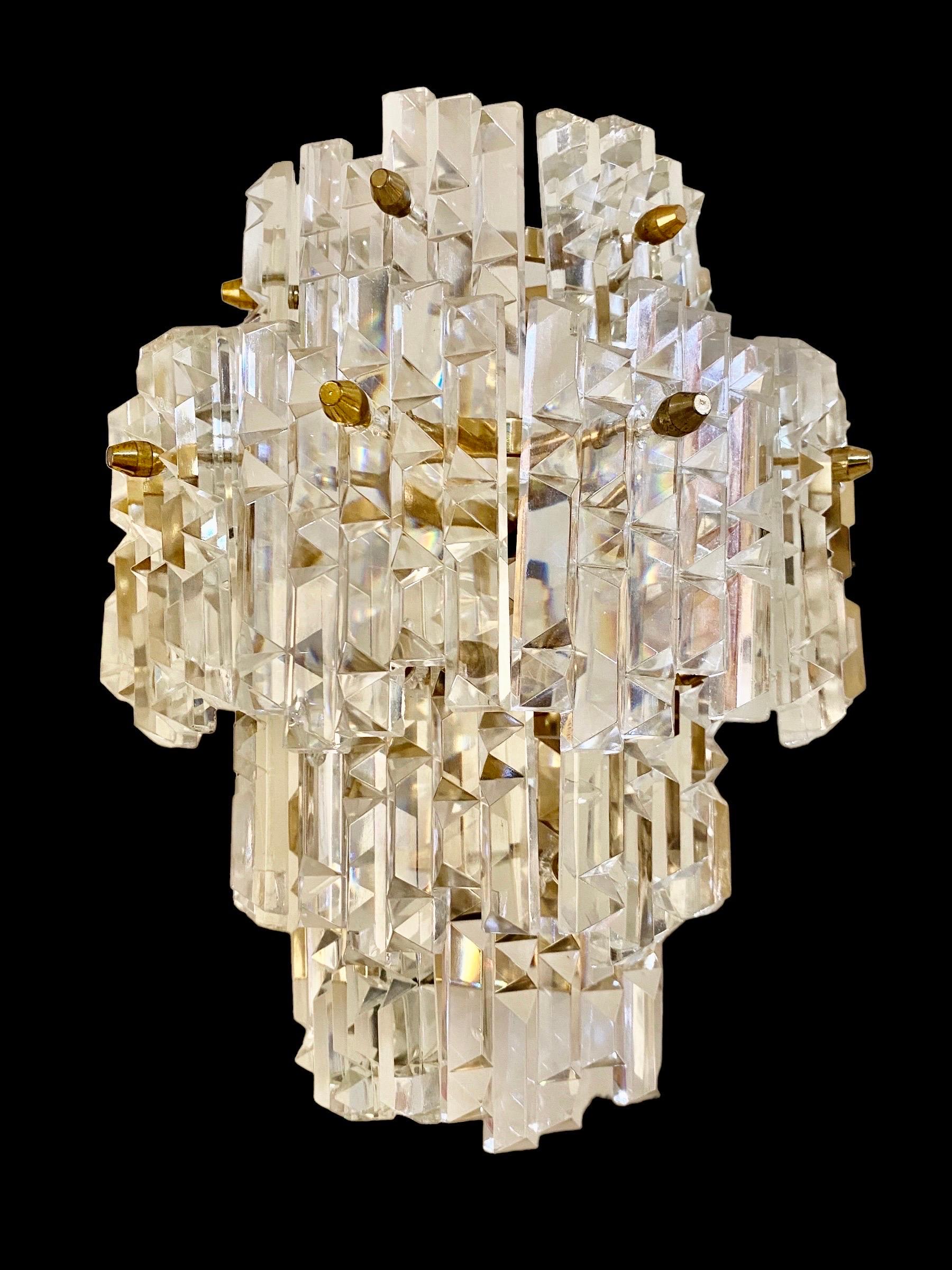 Austria wall lighting cut glass. The design and the quality of the glass make this piece the best of the Austrian design.

This artistic glass piece features the exclusive design of an austrian designer from the 1960s / 1970s. This wall lighting