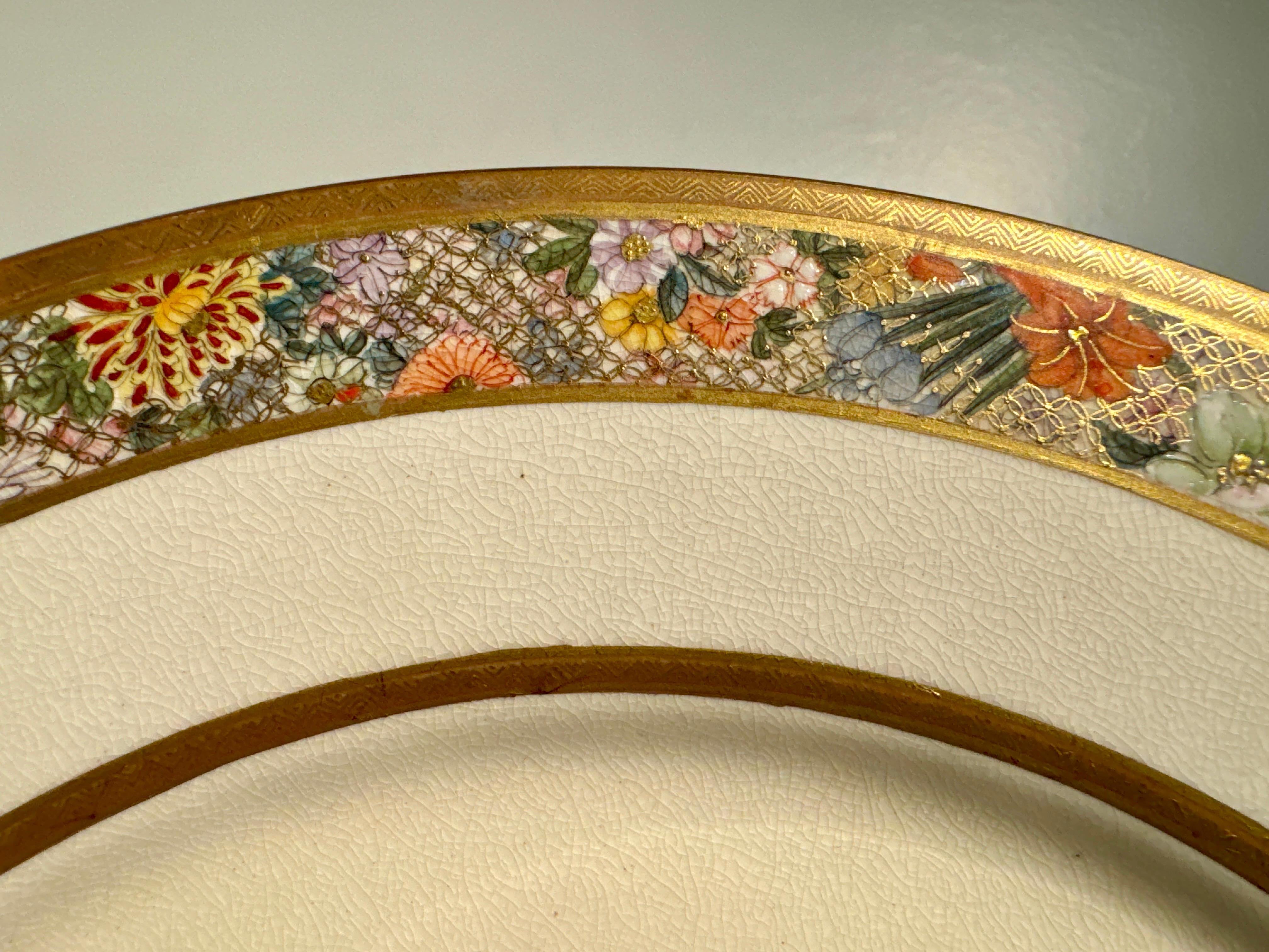 A very finely painted Japanese Satsuma plate with miniature figural paintings, signed Kinkozan for the Kinkozan workshops, Meiji Period, circa 1900, Japan.

The lovely plate crafted in the traditional Satsuma fashion, featuring a fine stoneware body
