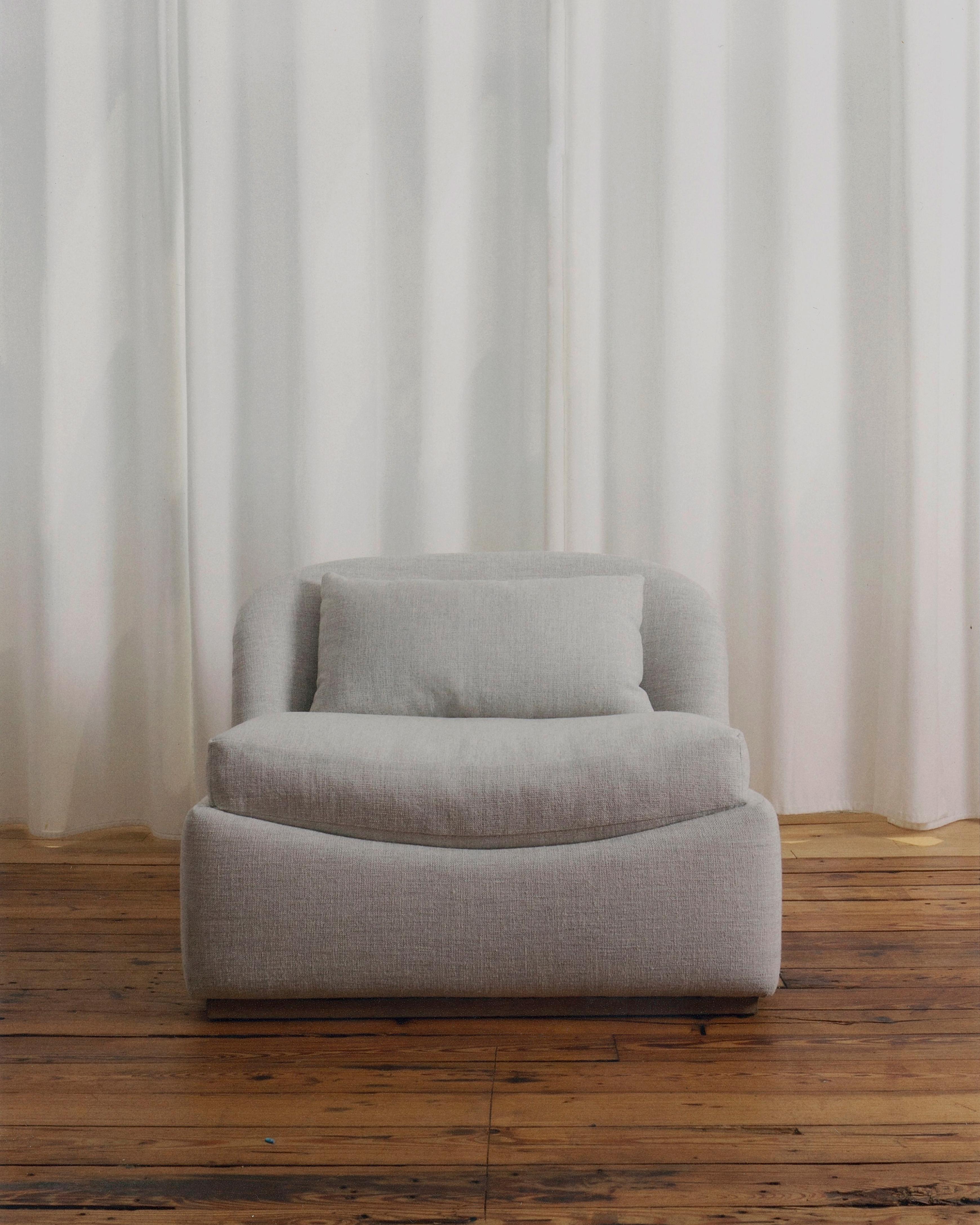 Low-slung chair embracing the sitter through it’s curved seat and backrest.
This piece is made to order and available in any combination fabric and wood.
Available in a Grande & Petite Size. Grand size shown in photos here.
------
Founded in 2017,