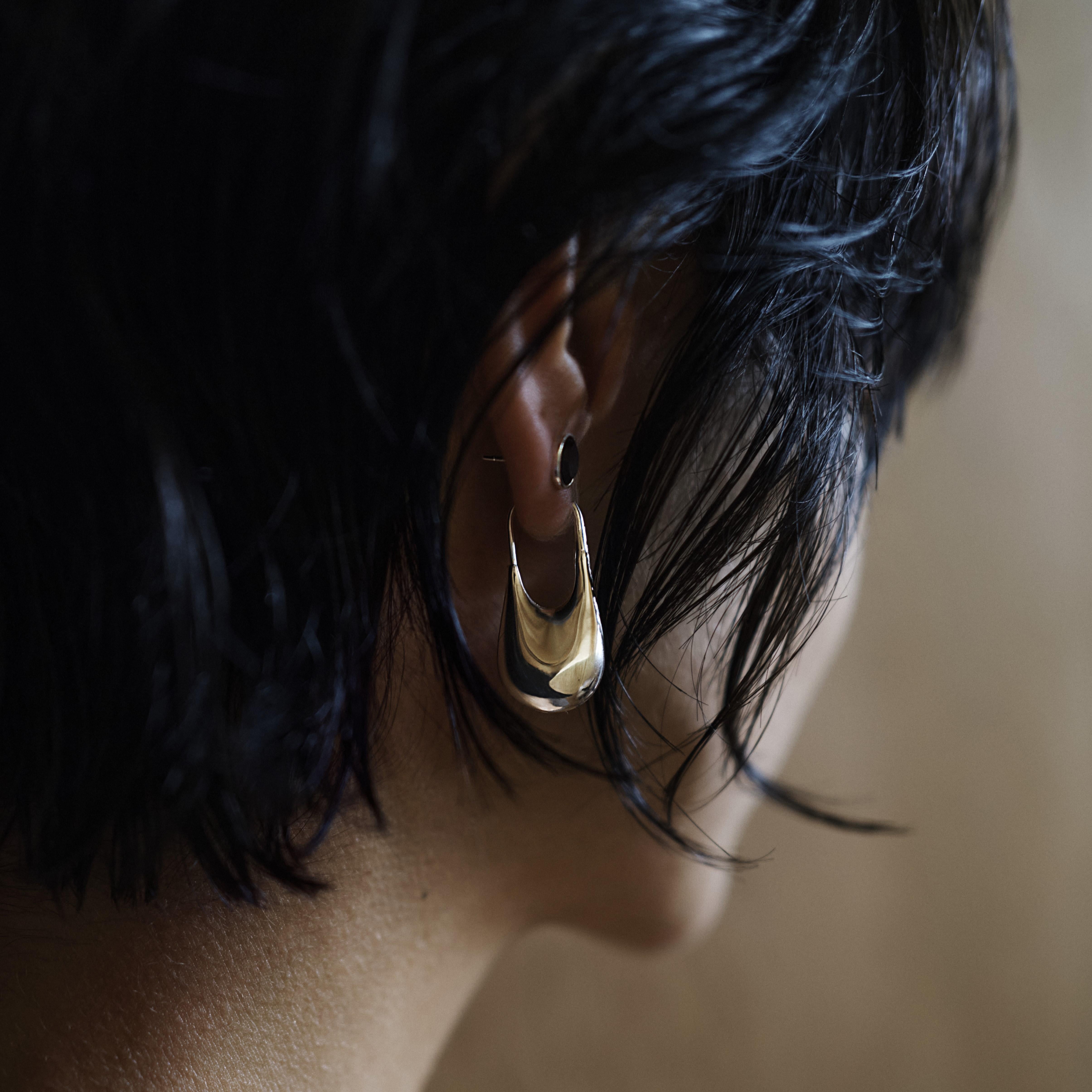 Also available in recycled 18k gold, as a pair and in large size.

The lightweight drop earring is a timeless piece of jewelry that is handcrafted using recycled sterling silver, making it both eco-friendly and durable. 

Created in Copenhagen as a