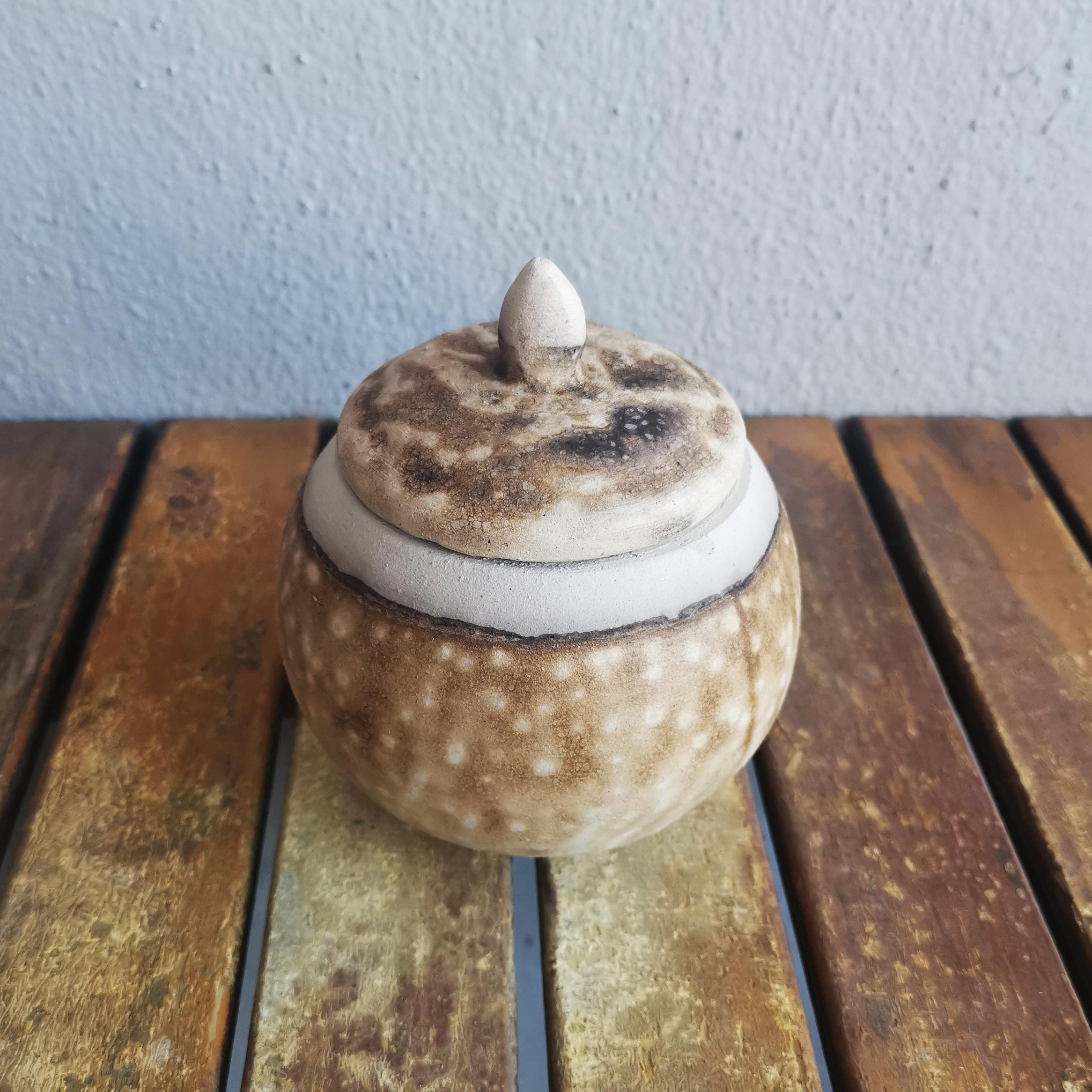 Kioku - Remembrance

The Kioku urn is a small palm sized urn that is formed with an organic spherical shape. This urn is very suitable for the remains of pets, or for shared remembrance among family members.

Height: 3.3 in (8.5Cm)
Width: 4 in