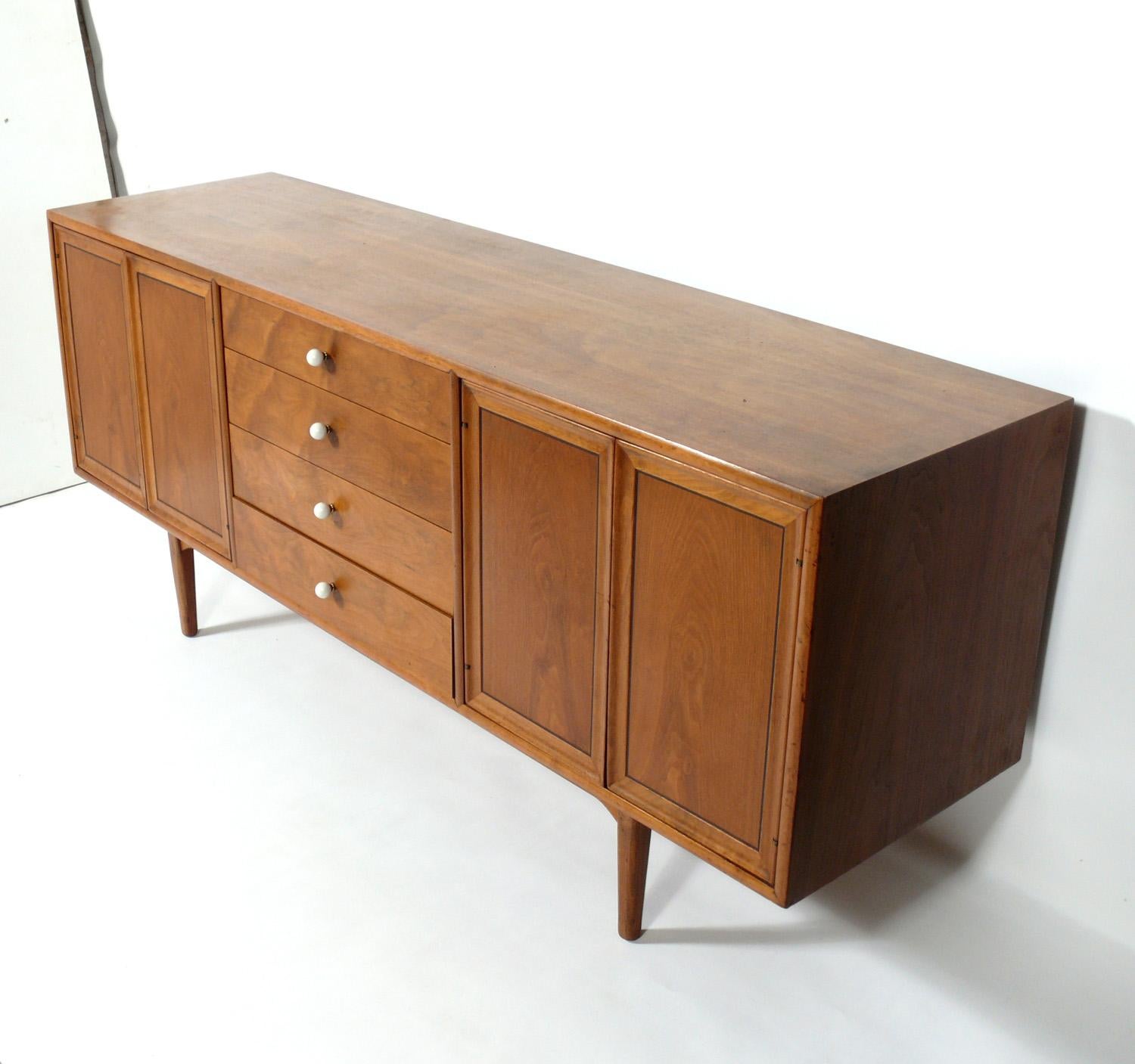 Mid-Century Modern Credenza or Chest, designed by Kipp Stewart for the Declaration line for Drexel, American, circa 1960s. Beautiful graining to the walnut. This piece is a versatile size and can be used as a credenza, media cabinet or bar in a