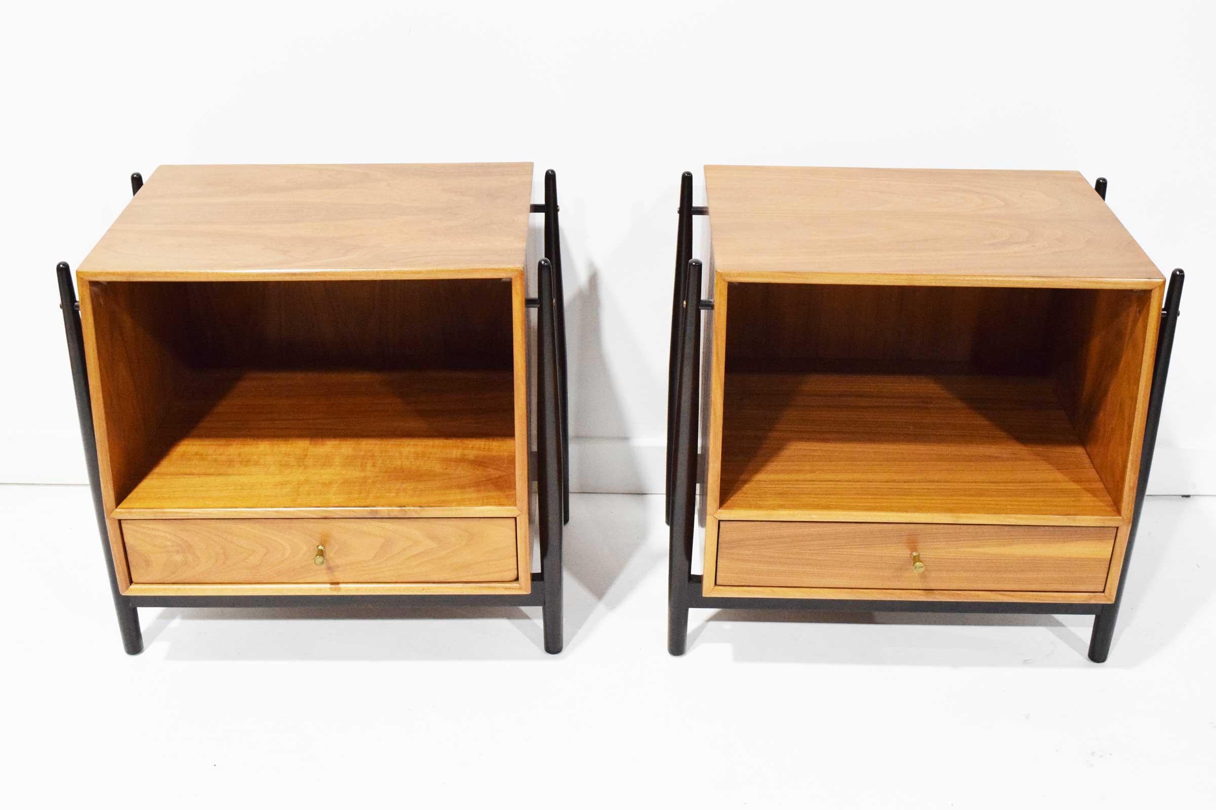 Exceptional pair of Mid-Century Modern nightstands or can also be used as side or end tables, designed by Kipp Stewart and Stewart McDougall as part of the 'Declaration' line for Drexel furniture. This design being the most coveted and in-demand of