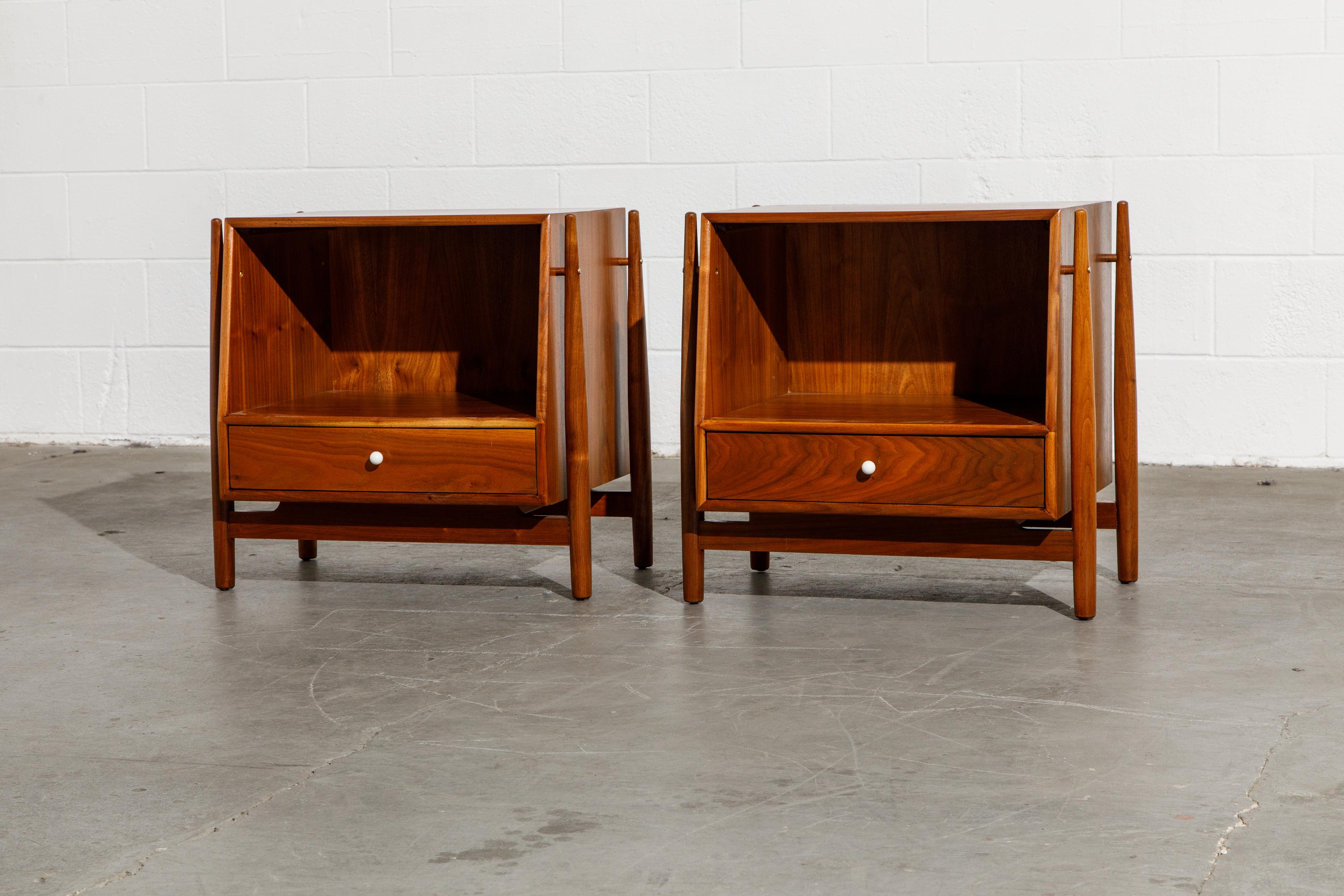 Exceptional pair of Mid-Century Modern nightstands or can also be used as side or end tables, designed by Kipp Stewart and Stewart McDougall as part of the 'Declaration' line for Drexel furniture. This design being the most coveted and in-demand of