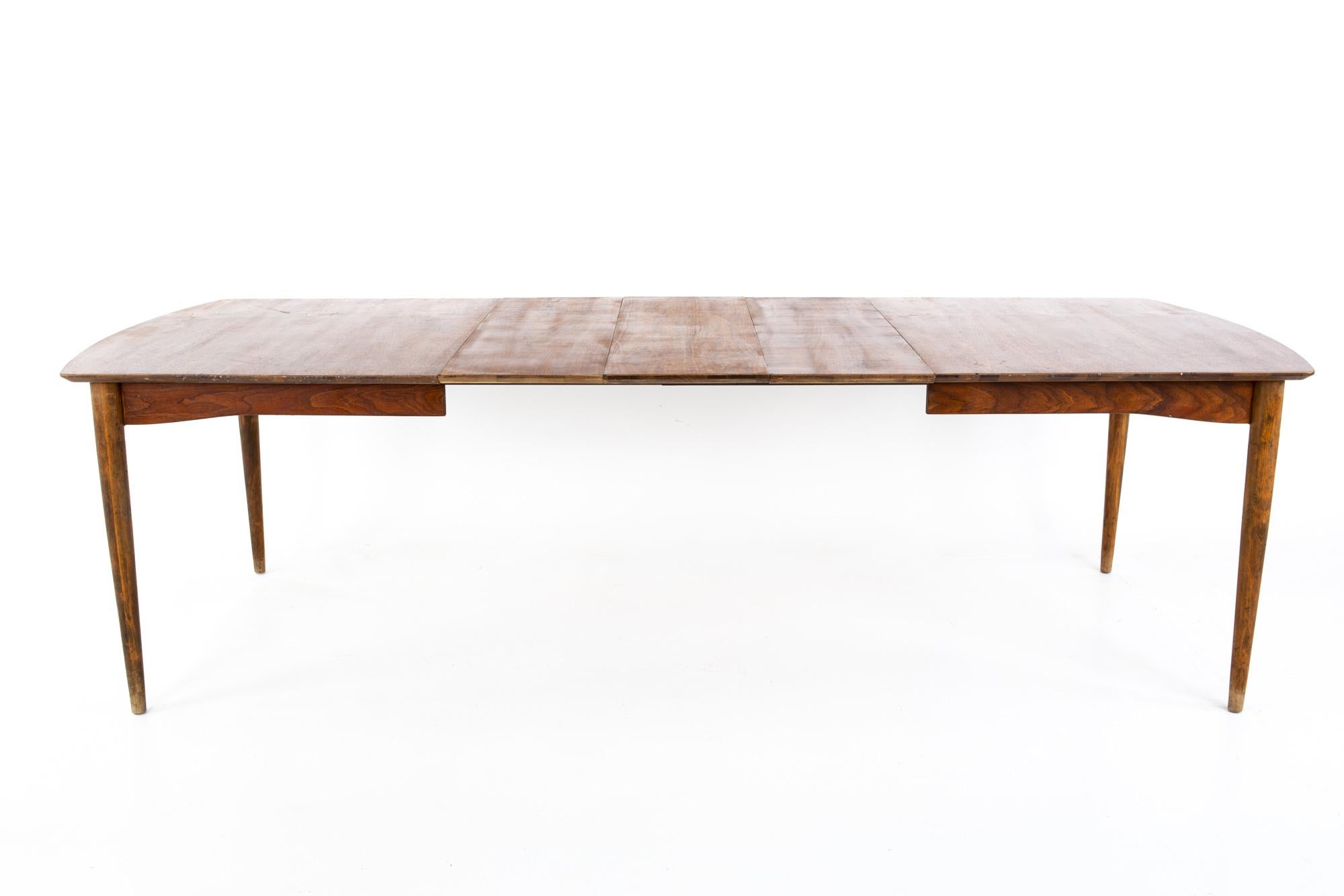 Kipp Stewart for Drexel Declaration style Morganton midcentury 10 person walnut dining table
Table measures: 62 wide x 38 deep x 28 inches high and there are 3 leaves; each leaf is 12 inches wide 

Each piece of furniture is available in what we