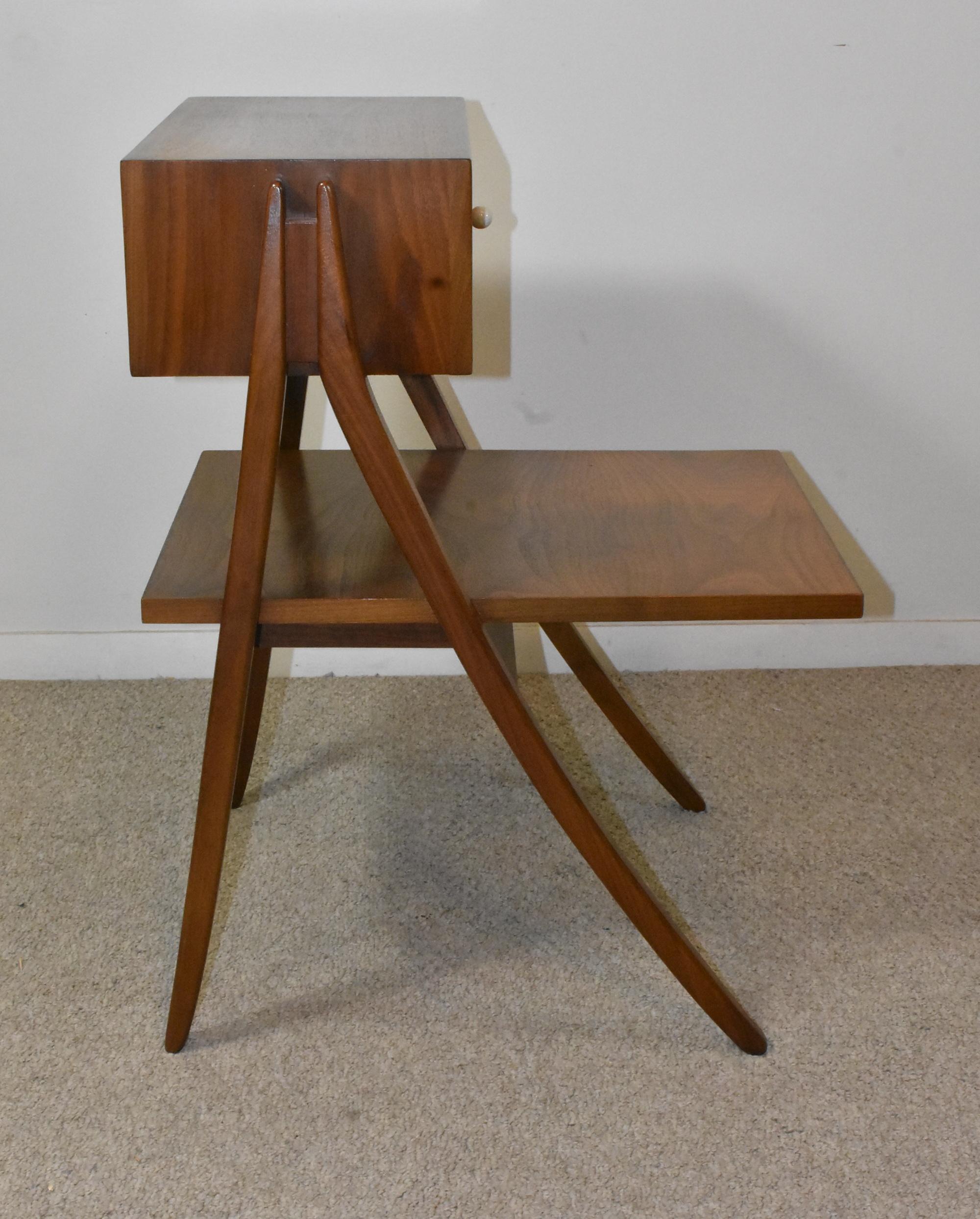 Walnut night stand by Kipp Stewart design for Drexel. Single drawer with overhanging shelf. Drexel stamp in the drawer. 21