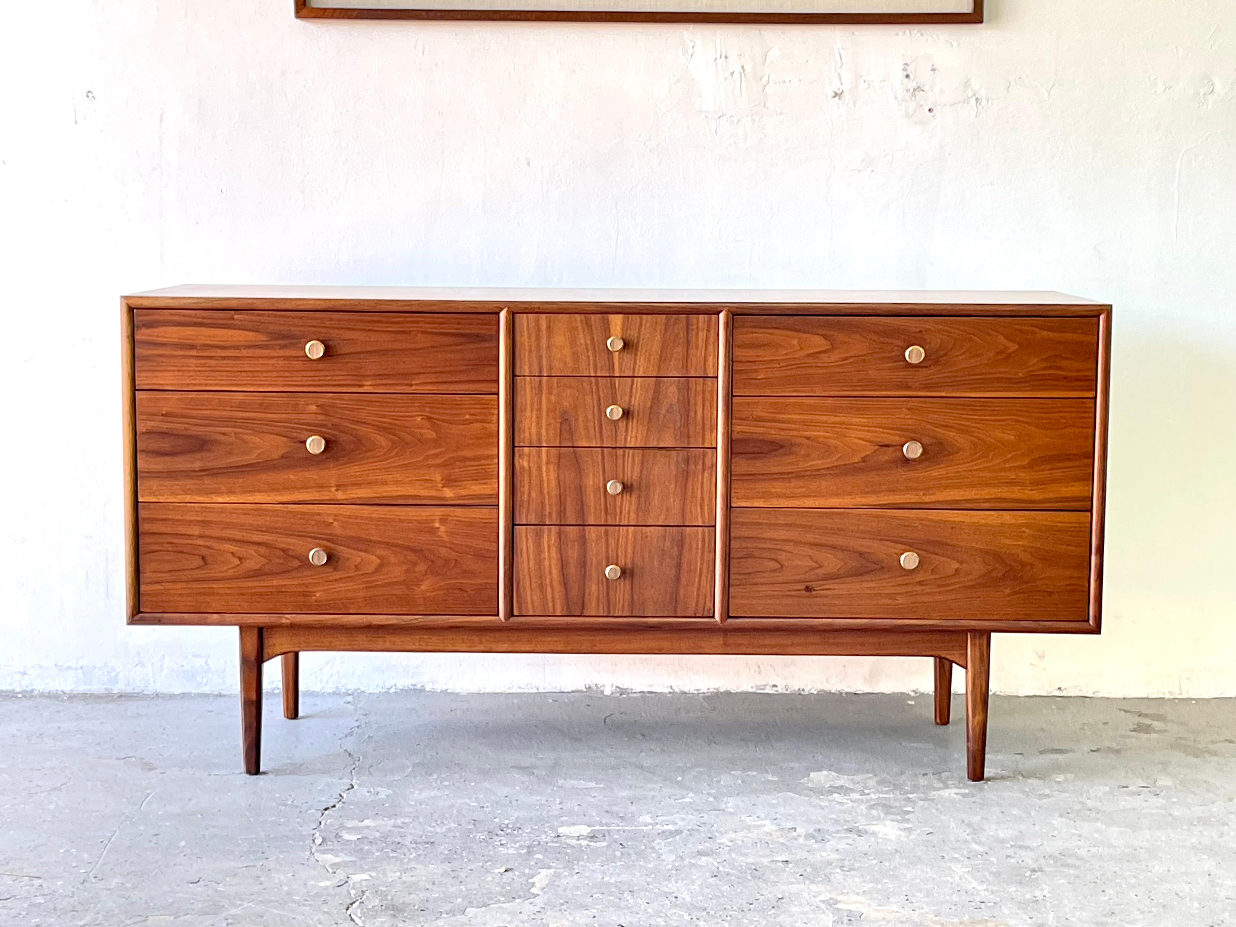 Mid-Century Modern walnut dresser designed by Kipp Stewart and Stewart McDougall for Drexel's Declaration collection. Exceptional quality dresser constructed from walnut. Features ten dovetailed drawers with original brass pulls. Featuring four
