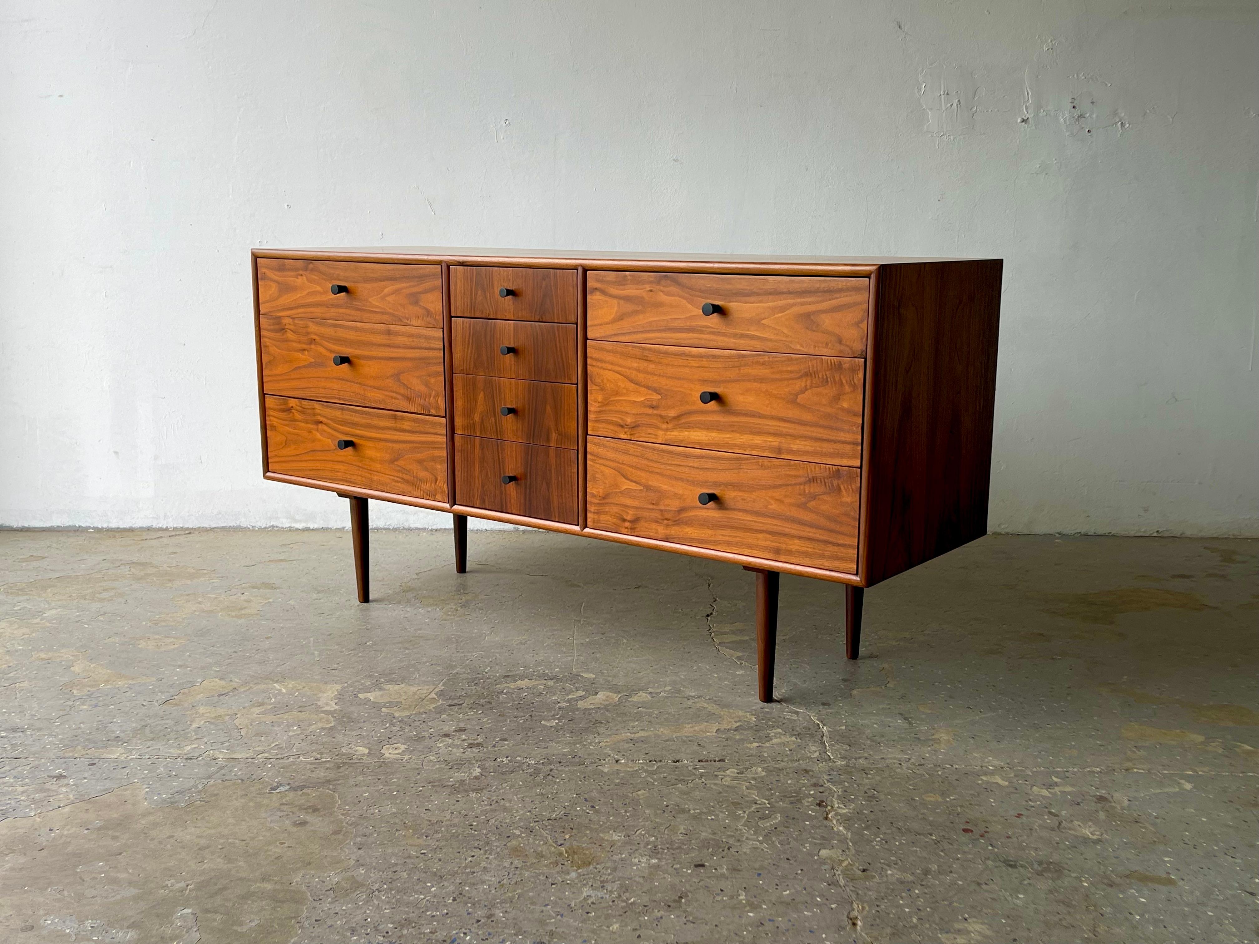 Mid-Century Modern walnut dresser designed by Kipp Stewart and Stewart McDougall for Drexel's Declaration collection. Exceptional quality dresser constructed from walnut. Features ten dovetailed drawers. Featuring four small drawers in the center