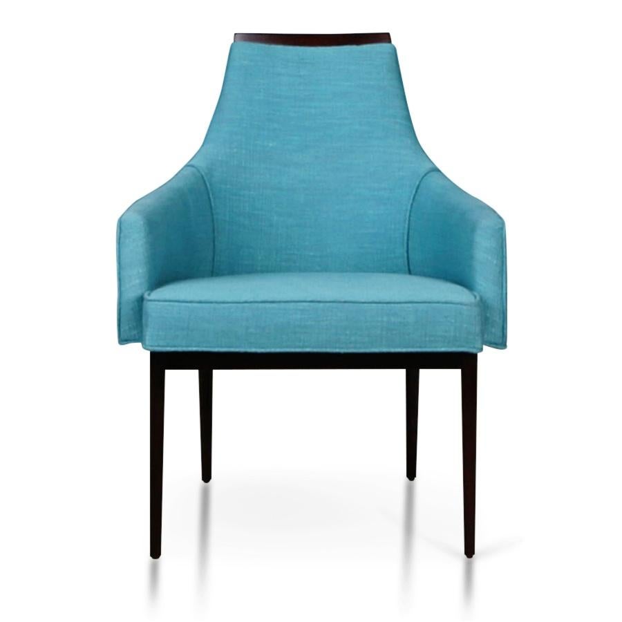 Pair of newly restored armchairs by Kipp Stewart for Calvin Furniture. These lounge chairs feature brand new upholstery in an eye-catching teal with welting running along the contours, which compliments the freshly lacquered walnut frames. 

This