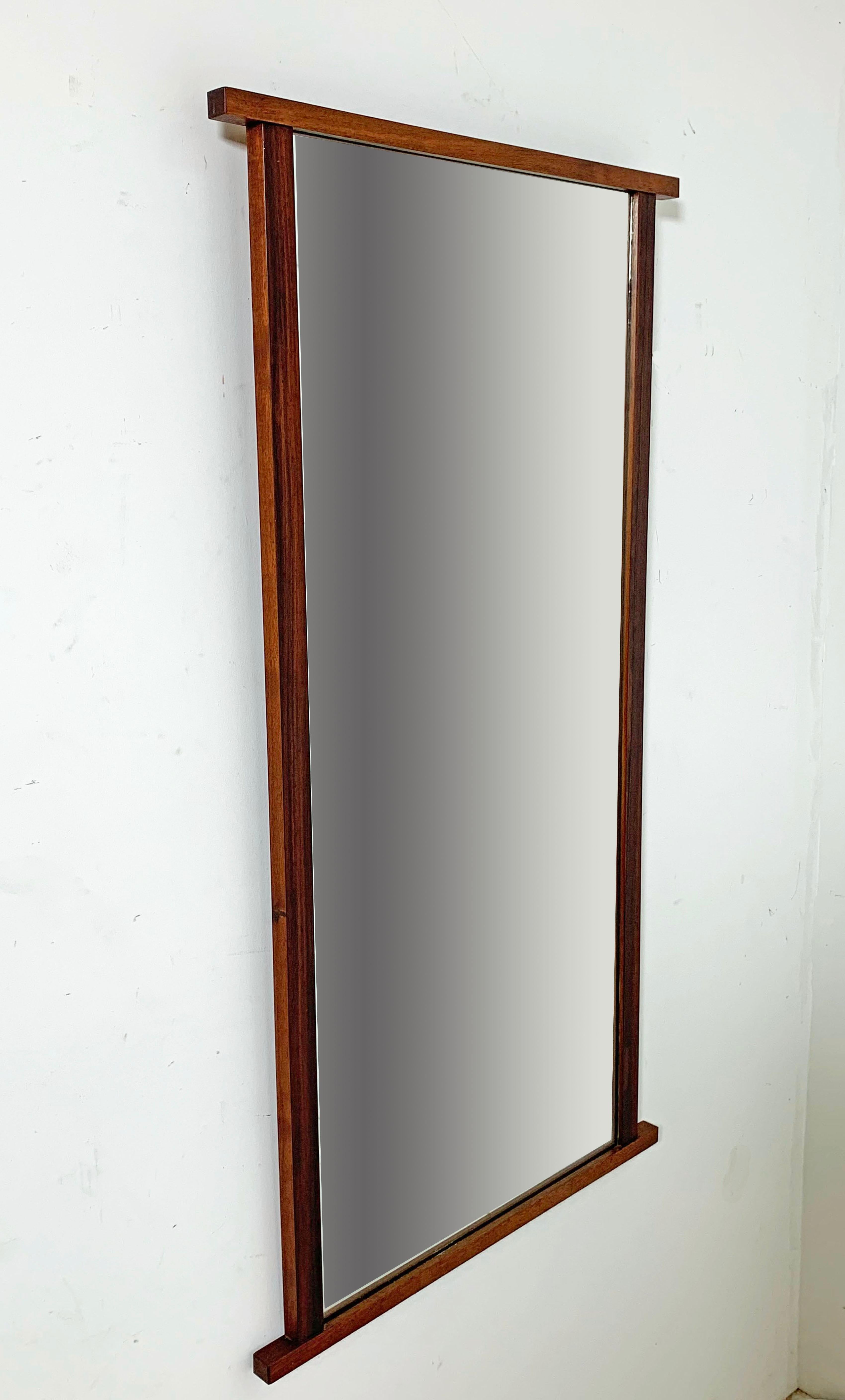 An architectural mirror in solid walnut from the 1959 American Design Foundation collection by Kipp Stewart and Stewart MacDougal for Calvin Furniture. Can be oriented vertically or horizontally.