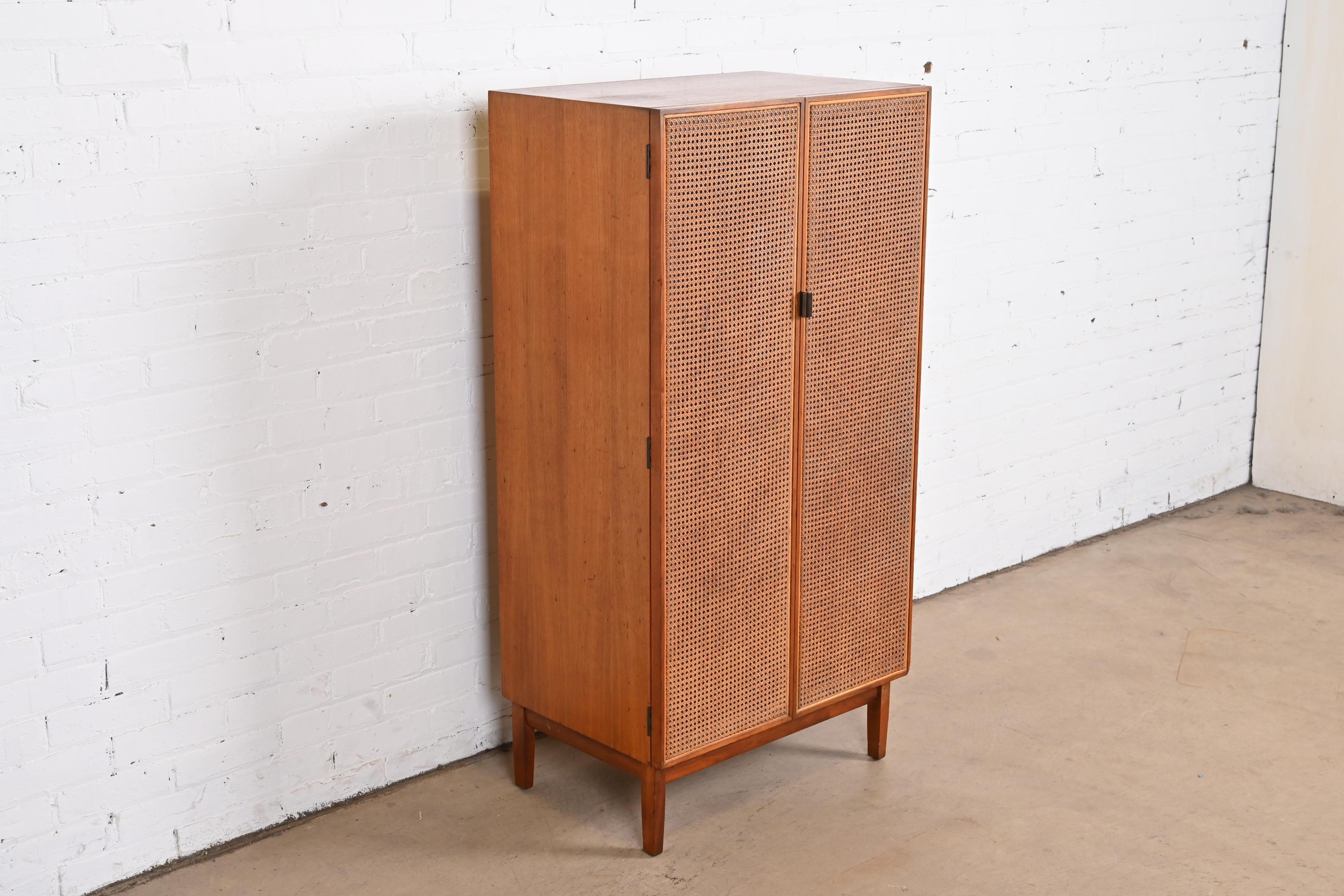 Mid-20th Century Kipp Stewart for Calvin Furniture Walnut and Cane Ten-Drawer Dresser Chest