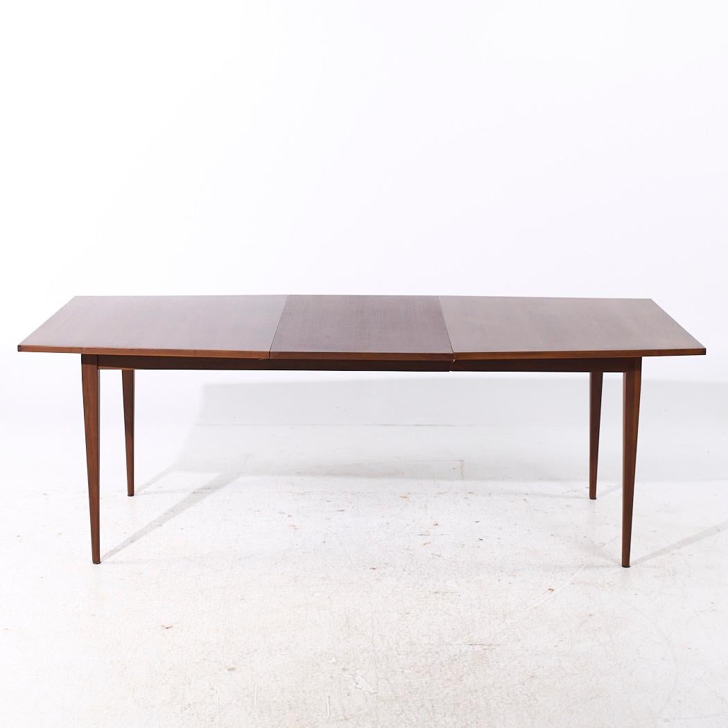 Kipp Stewart for Calvin Mid Century Walnut Expanding Dining Table with 1 Leaf

This table measures: 62 wide x 40 deep x 29.25 inches high, with a chair clearance of 28.25 inches, the leaf measures 22 inches wide, making a maximum table width of 84