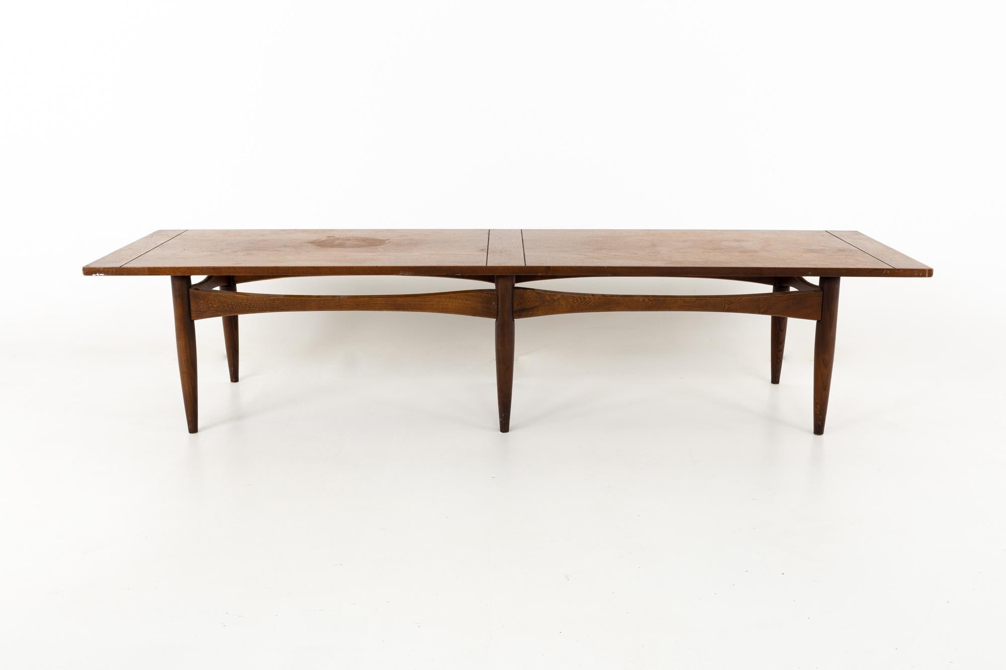 Kipp Stewart for Calvin style Mid Century walnut and rosewood inlay coffee table
This coffee table is 66 wide x 19 deep x 16 inches high

All pieces of furniture can be had in what we call restored vintage condition. That means the piece is restored