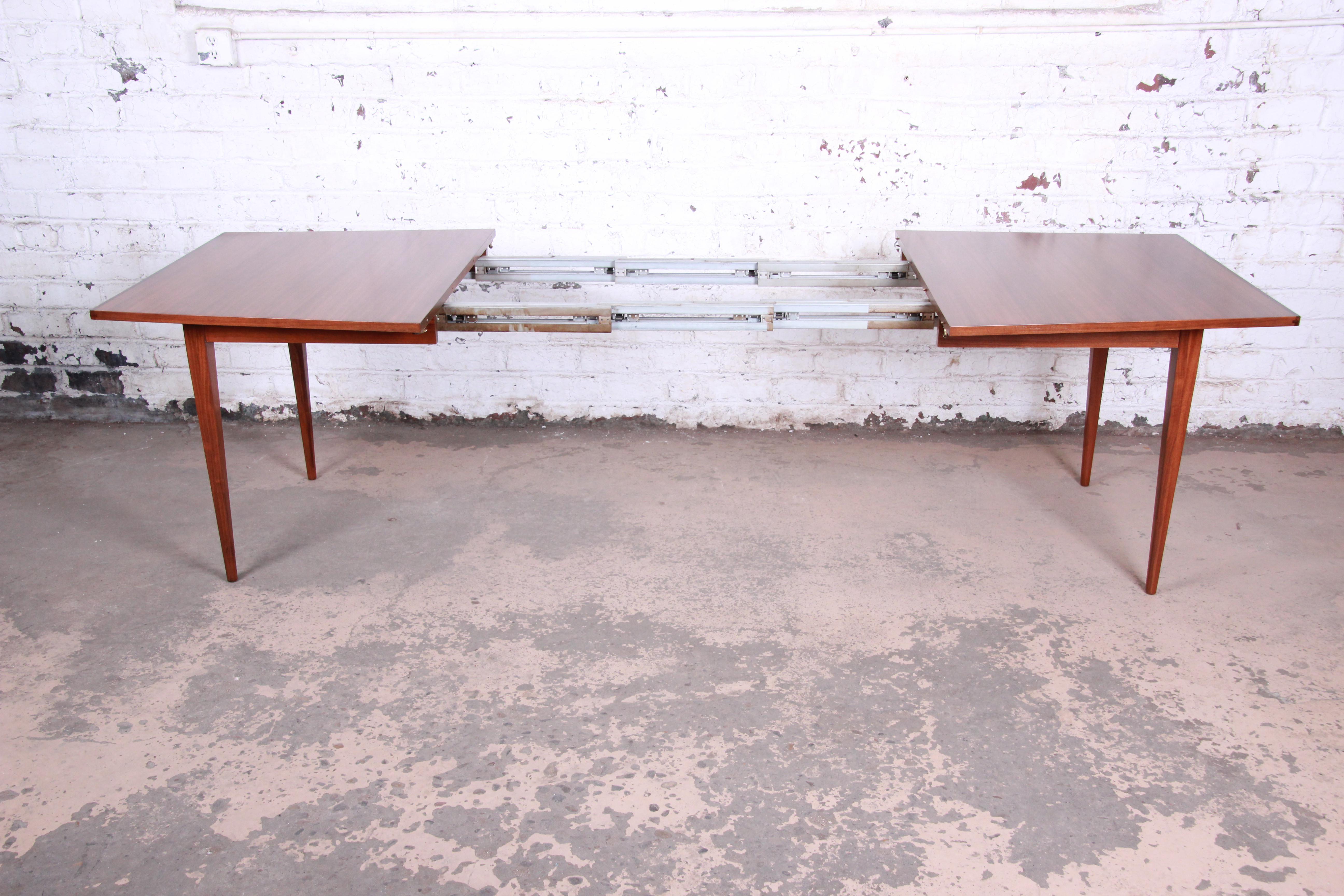 Mid-20th Century Kipp Stewart for Calvin Walnut and Rosewood Boat-Shaped Extension Dining Table