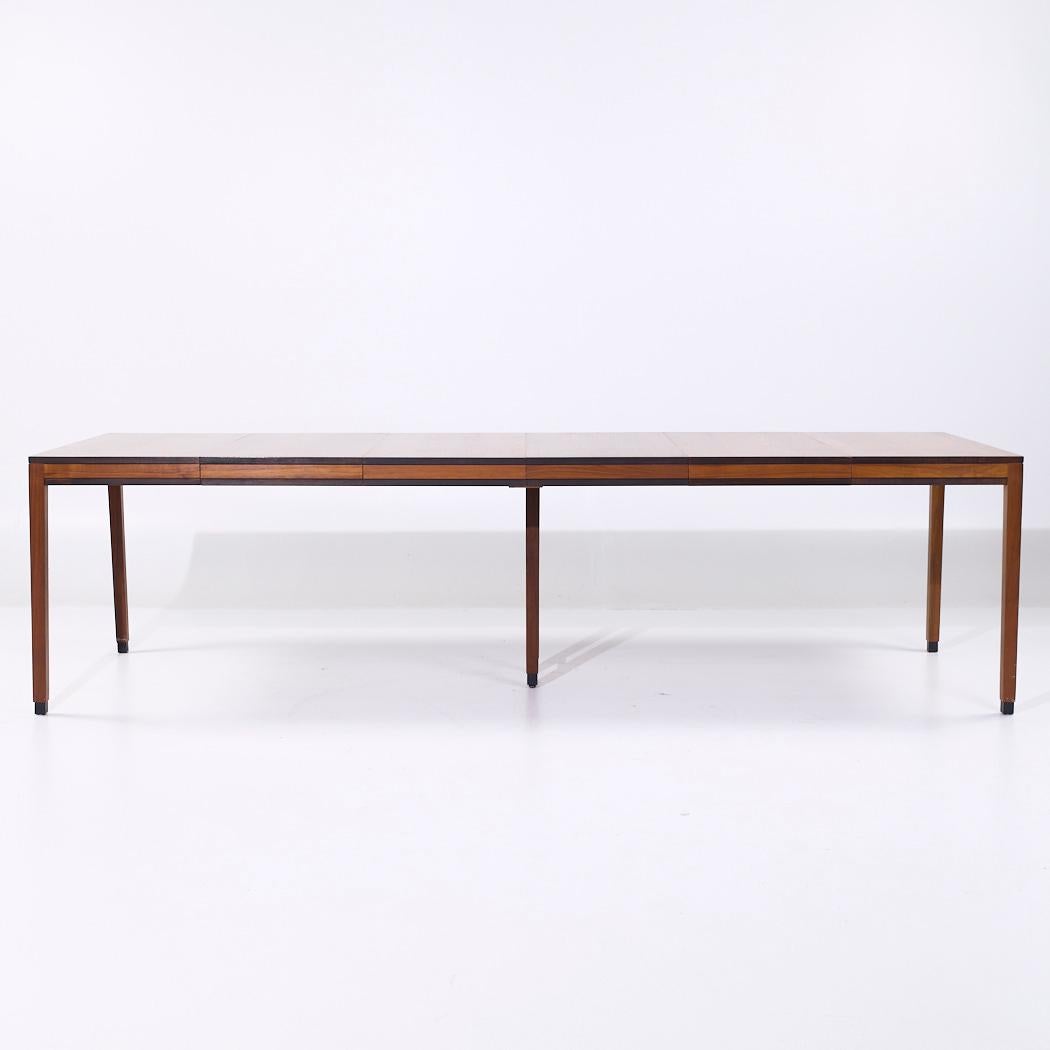 Kipp Stewart for Directional Style Mid Century Walnut Parsons Expanding Dining Table with 4 Leaves

This table measures: 38 wide x 38 deep x 29.25 inches high, with a chair clearance of 26 inches, each leaf measures 18 inches wide, making a maximum