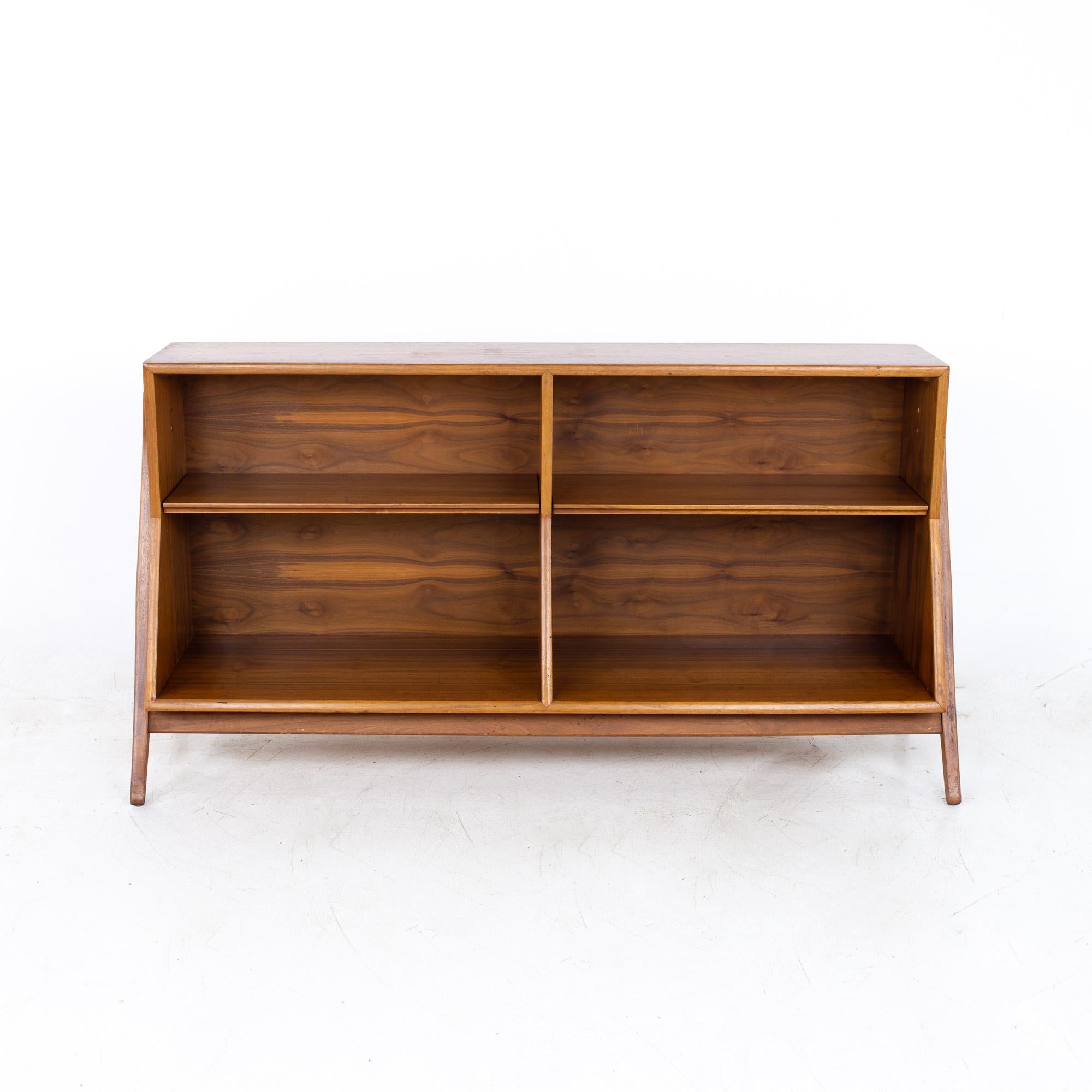Kipp Stewart For Drexel Declaration mid century bookcase

Bookcase measures: 60.25 wide x 16.25 deep x 31 inches high

All pieces of furniture can be had in what we call restored vintage condition. That means the piece is restored upon purchase