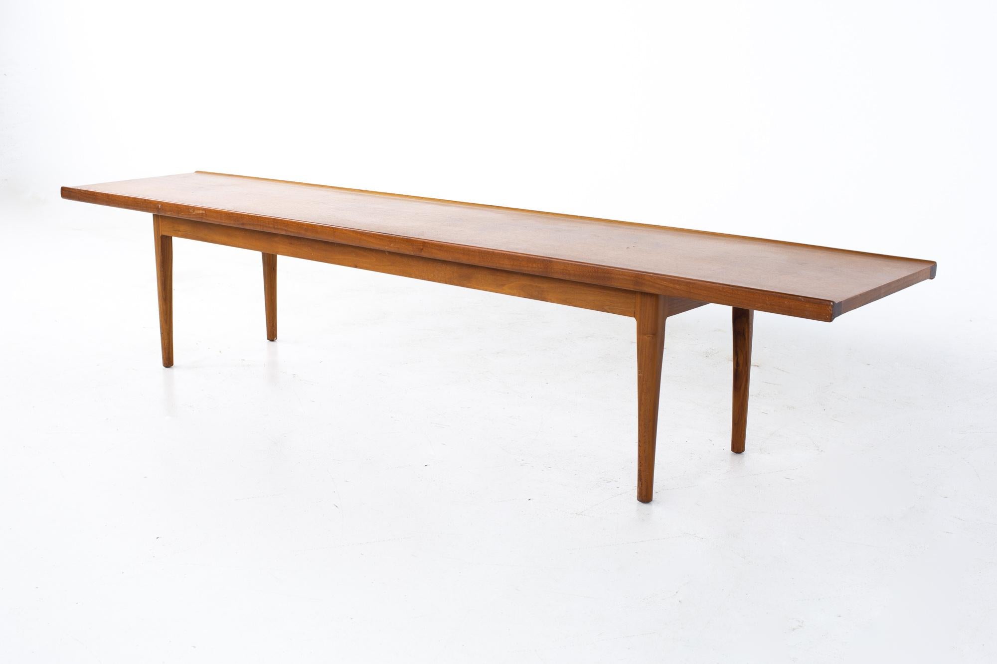 Kipp Stewart for Drexel Declaration mid century long walnut coffee table
Table measures: 75 wide x 16 deep x 15.5 inches high

All pieces of furniture can be had in what we call restored vintage condition. That means the piece is restored upon