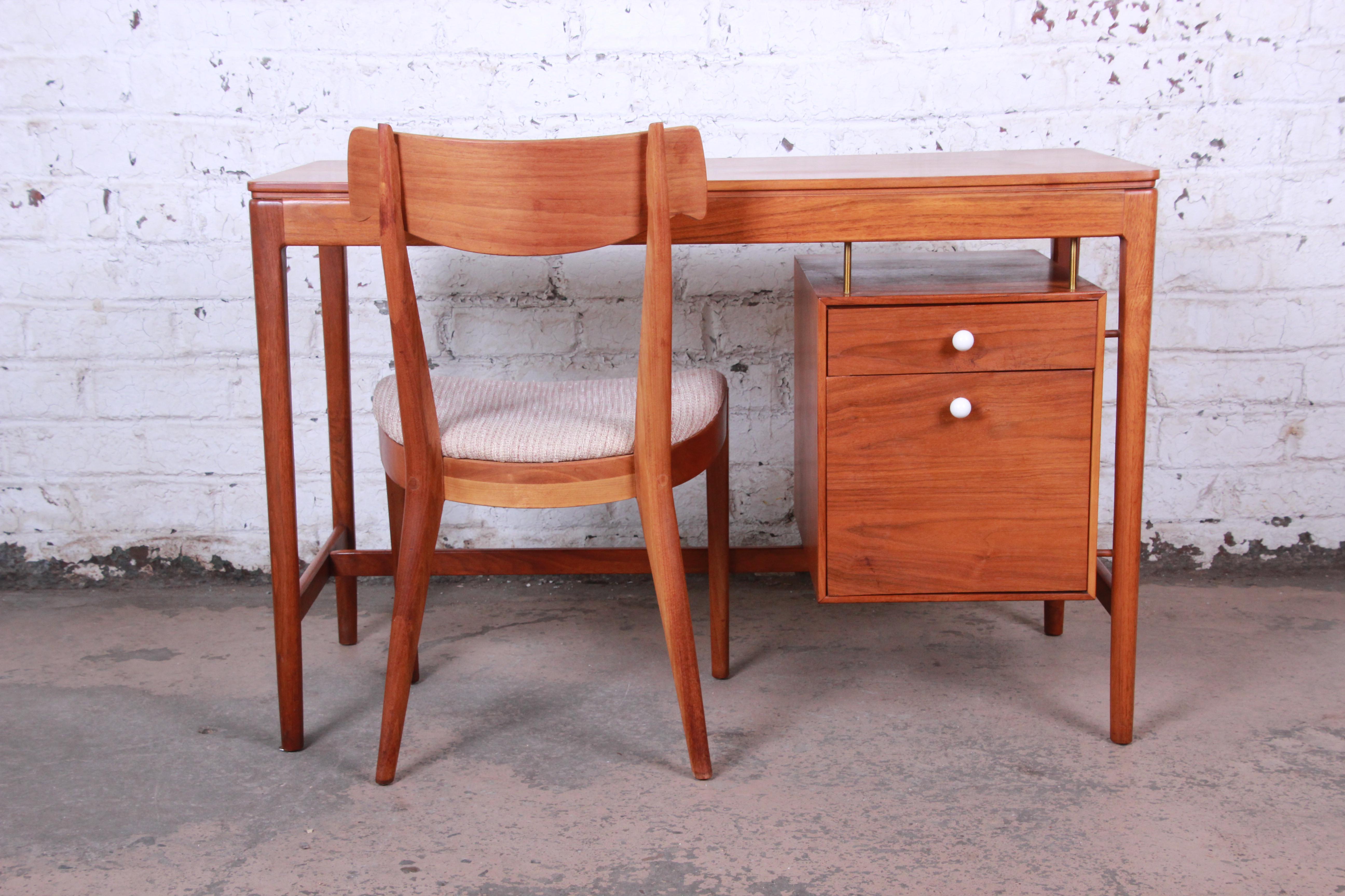 Offering an exceptional Mid-Century Modern walnut desk and chair designed by Kipp Stewart for his Declaration line for Drexel. The desk features gorgeous walnut wood grain and sleek midcentury Danish-inspired design. It offers good storage, with a