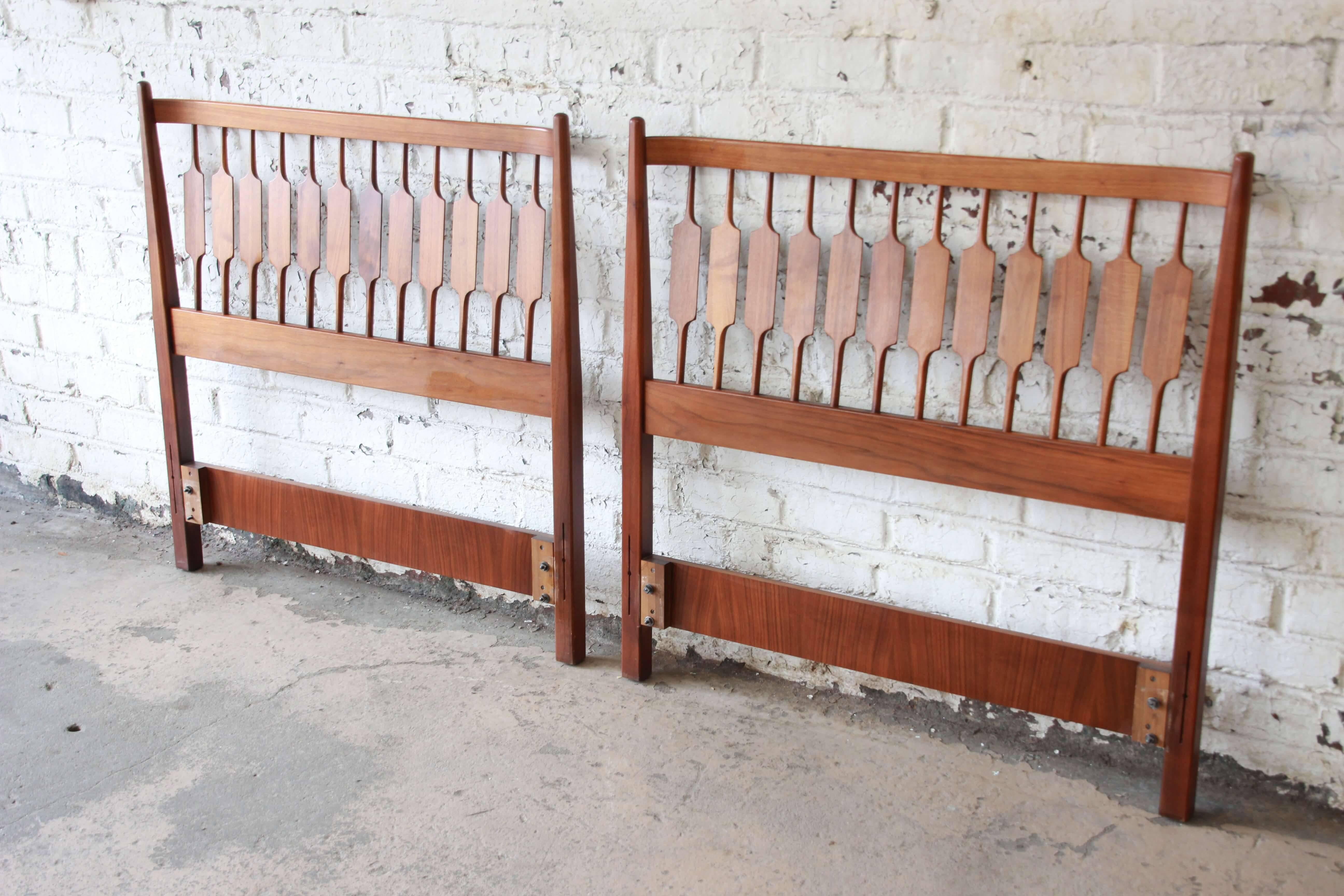Offering a very nice pair of Kipp Stewart for Drexel Declaration Mid-Century Modern twin headboards. This set is made from solid walnut and has a fantastic walnut wood grain with modern spindle design. Great addition to any modern bedroom. The
