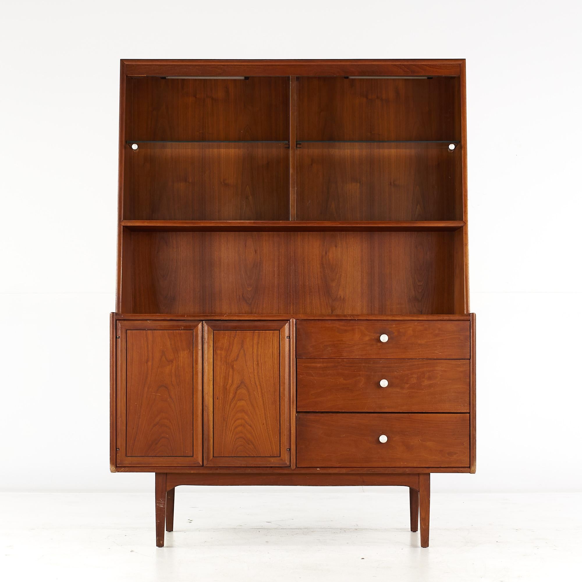 Kipp Stewart for Drexel Declaration Mid Century Walnut Buffet and Hutch

This buffet and hutch measures: 48.5 wide x 20 deep x 67 inches high

All pieces of furniture can be had in what we call restored vintage condition. That means the piece is