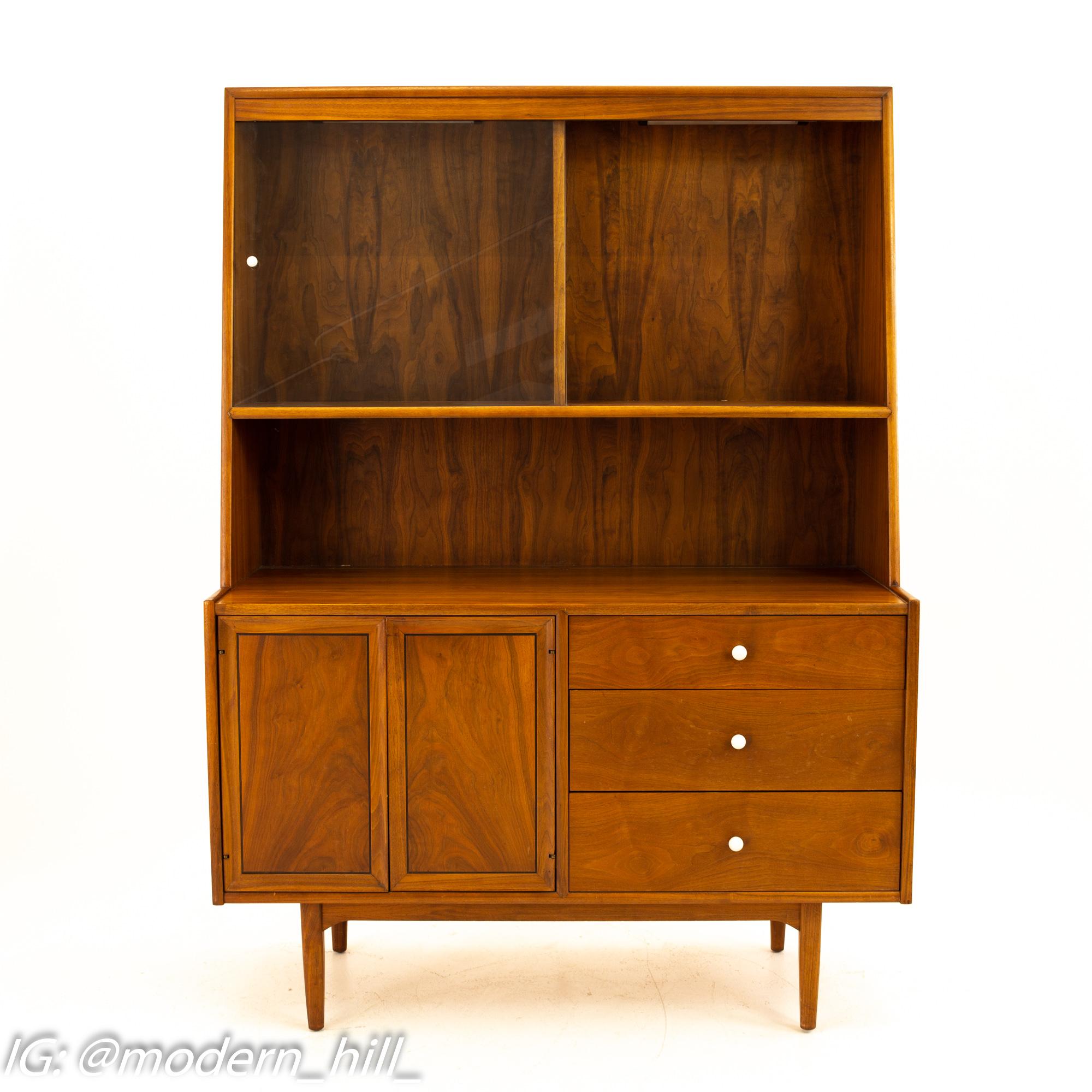 Kipp Stewart for Drexel Declaration Mid Century Walnut Buffet & Hutch

Buffet measures: 48.5 wide x 20 deep x 67.25

All pieces of furniture can be had in what we call restored vintage condition. That means the piece is restored upon purchase so